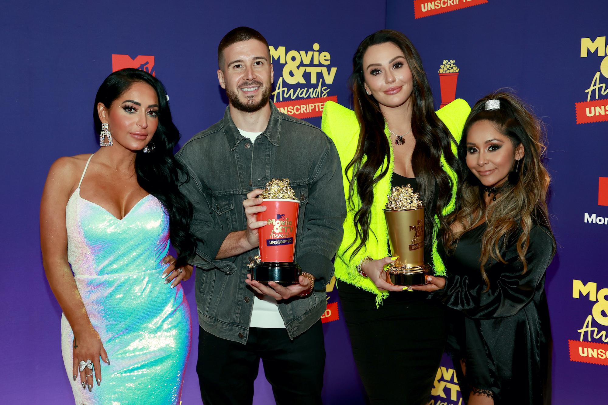 Angelina Larangeira, Vinny Guadagnino, Jenni 'JWoww' Farley, and Nicole 'Snooki' Polizzi show off their Reality Royalty win at the 2021 MTV Movie and TV Awards