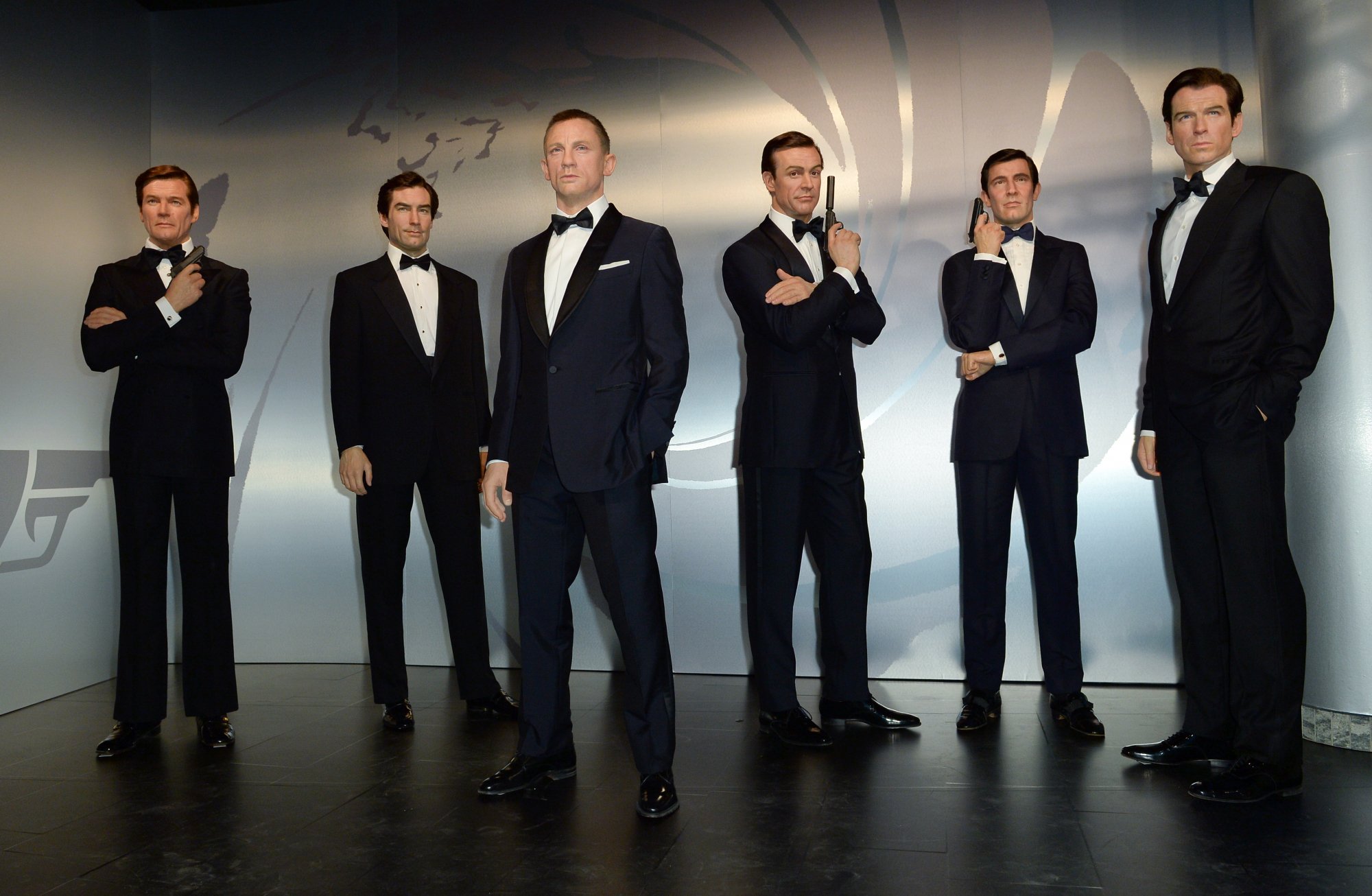 James Bond Madame Tussaud exhibit featuring Roger Moore, Timothy Dalton, Daniel Craig, Sean Connery, George Lazenby and Pierce Brosnan wax figures