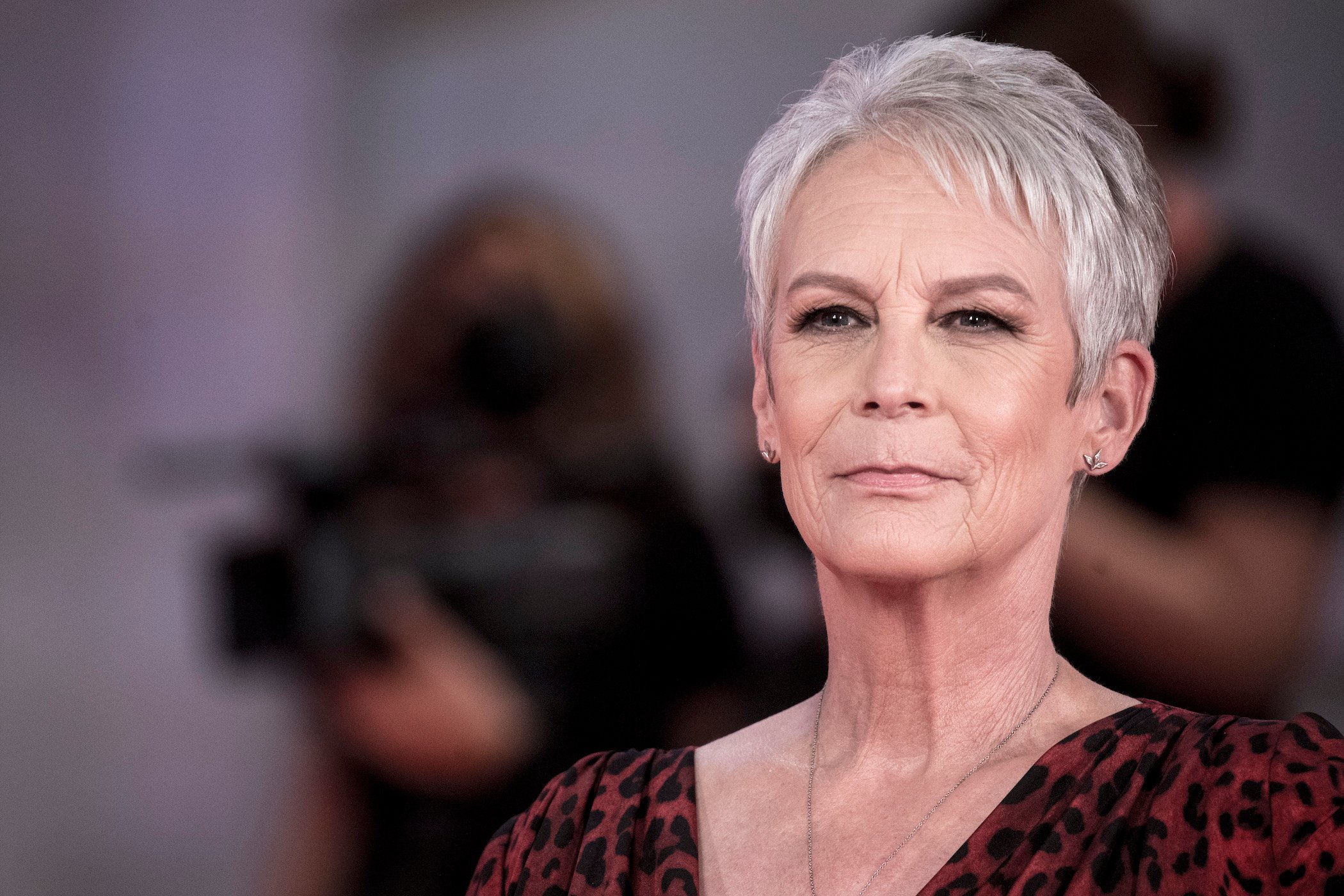 Jamie Lee Curtis smiling for the cameras at the Venice Film Festival to promote her Halloween Kills movie