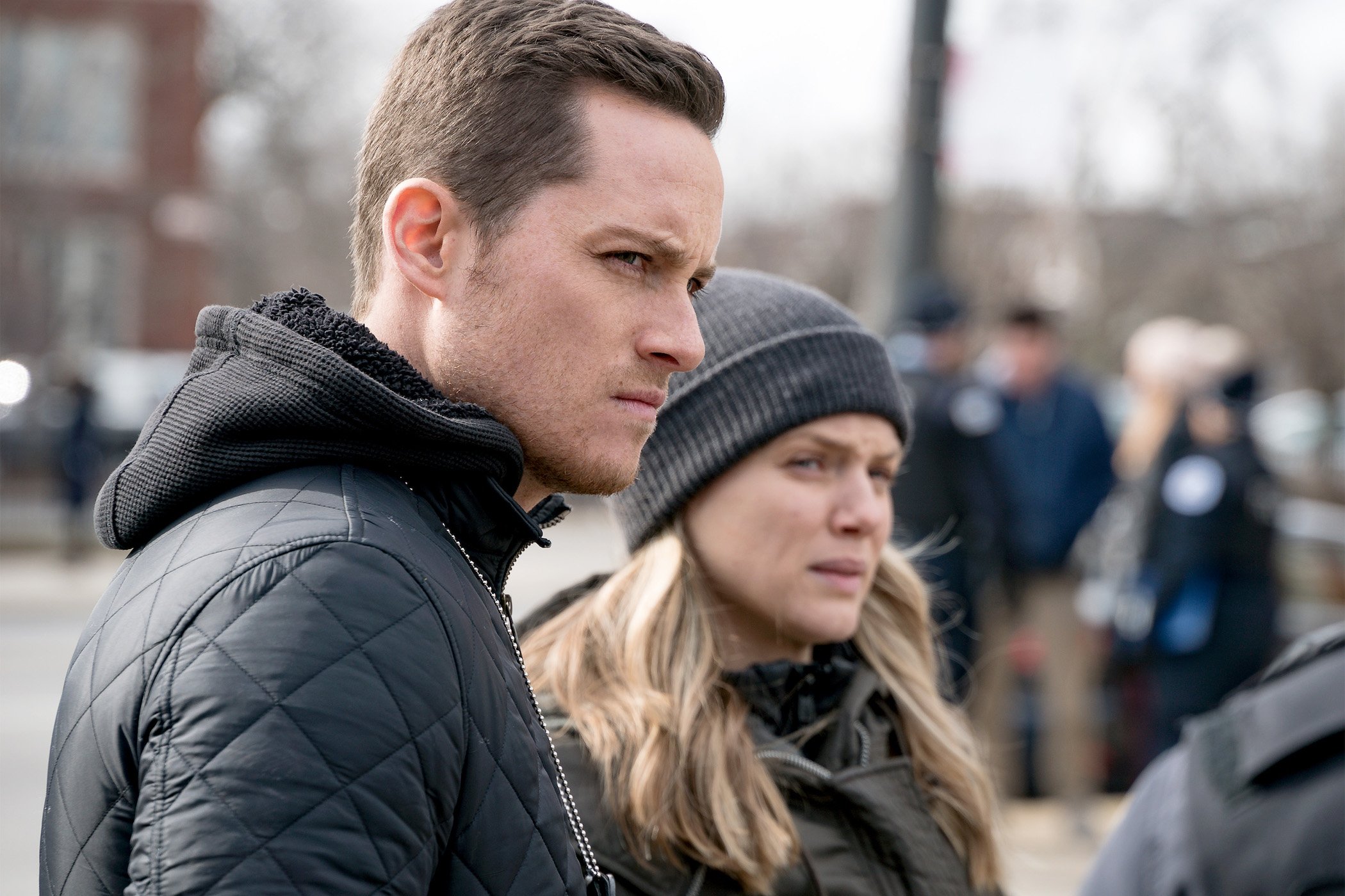 Jay Halstead and Hailey Upton from 'Chicago P.D.' Season 9 standing next to each other
