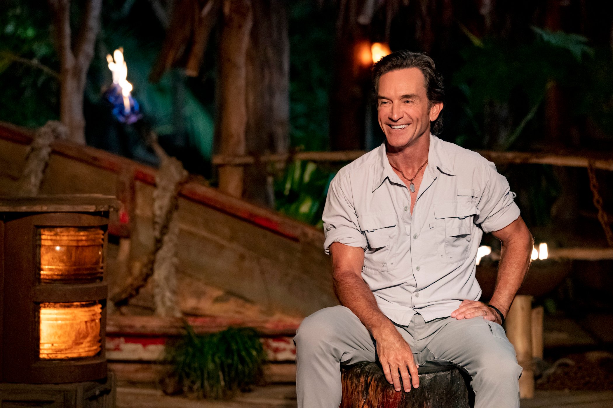 'Survivor' Season 41 host Jeff Probst smiling at 'Survivor' Season 41 cast members out of frame at Tribal Council