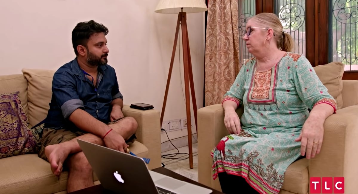 Jenny Slatten and Sumit Singh looking worried, talking in their livingroom in their home in India on '90 Day Fiancé: The Other Way'