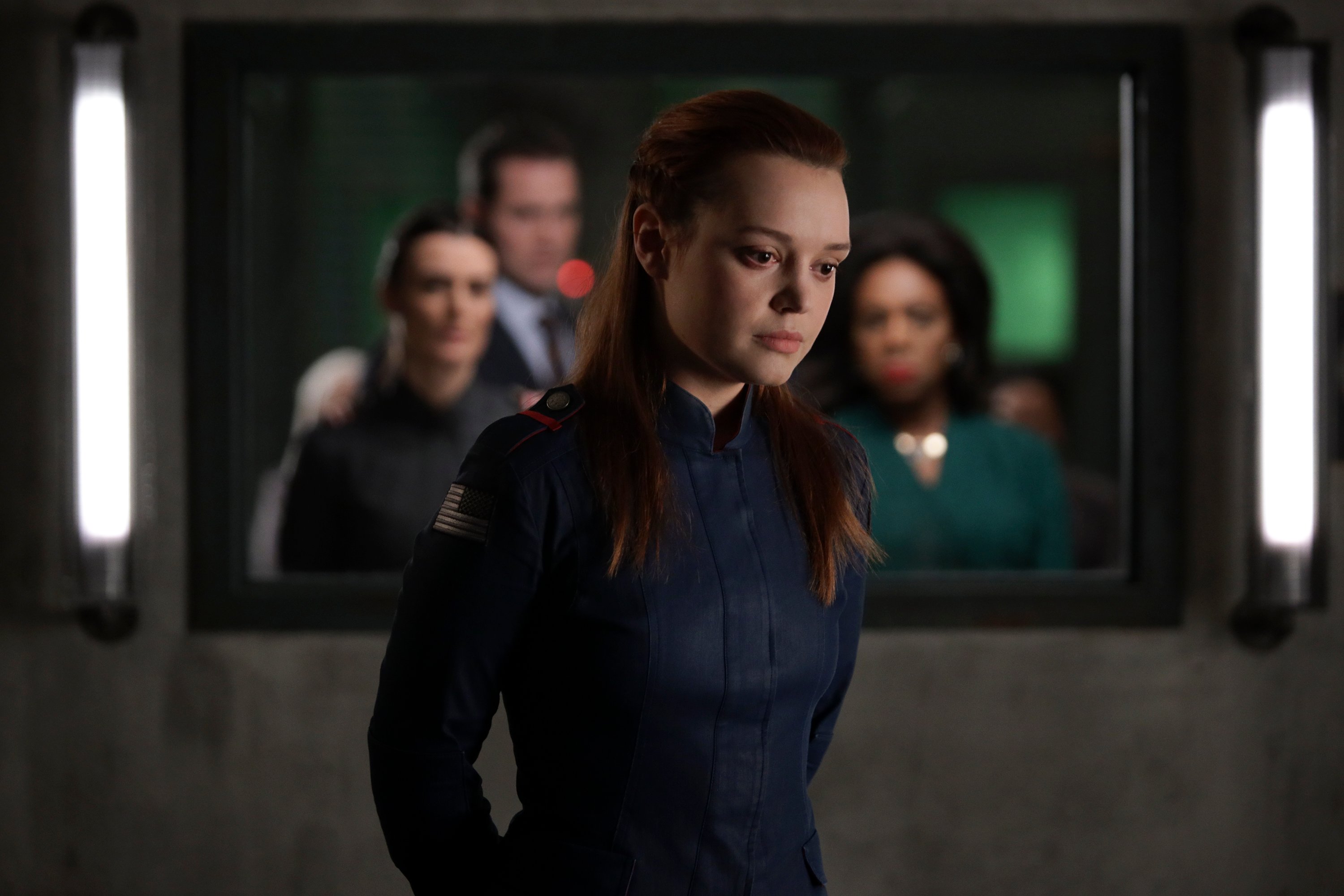 Jessica Sutton as Tally 'Motherland: Fort Salem' wearing army uniform in interrogation room in Season 2