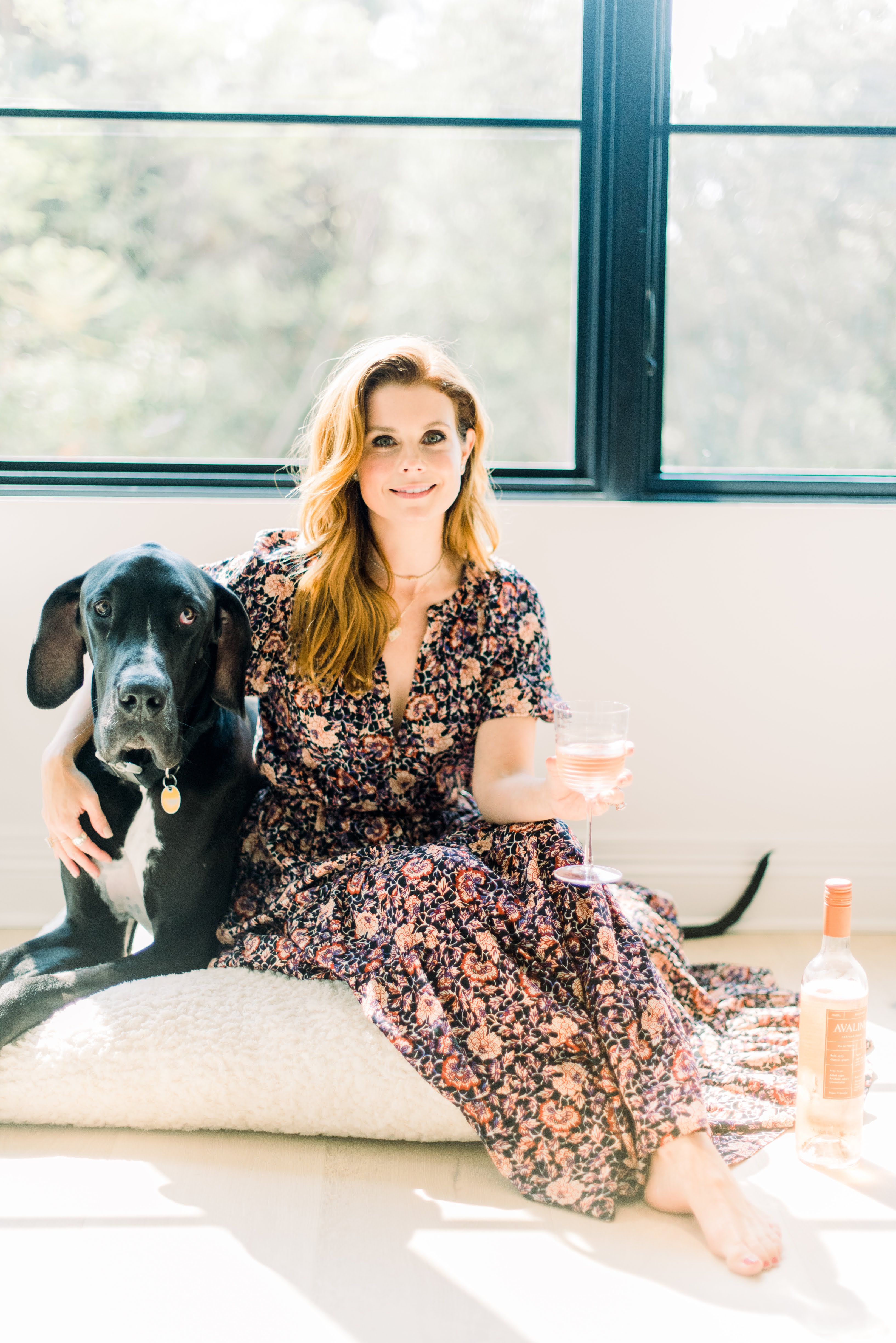 JoAnna Garcia Swisher puts her arm around Romeo and holds a glass of wine