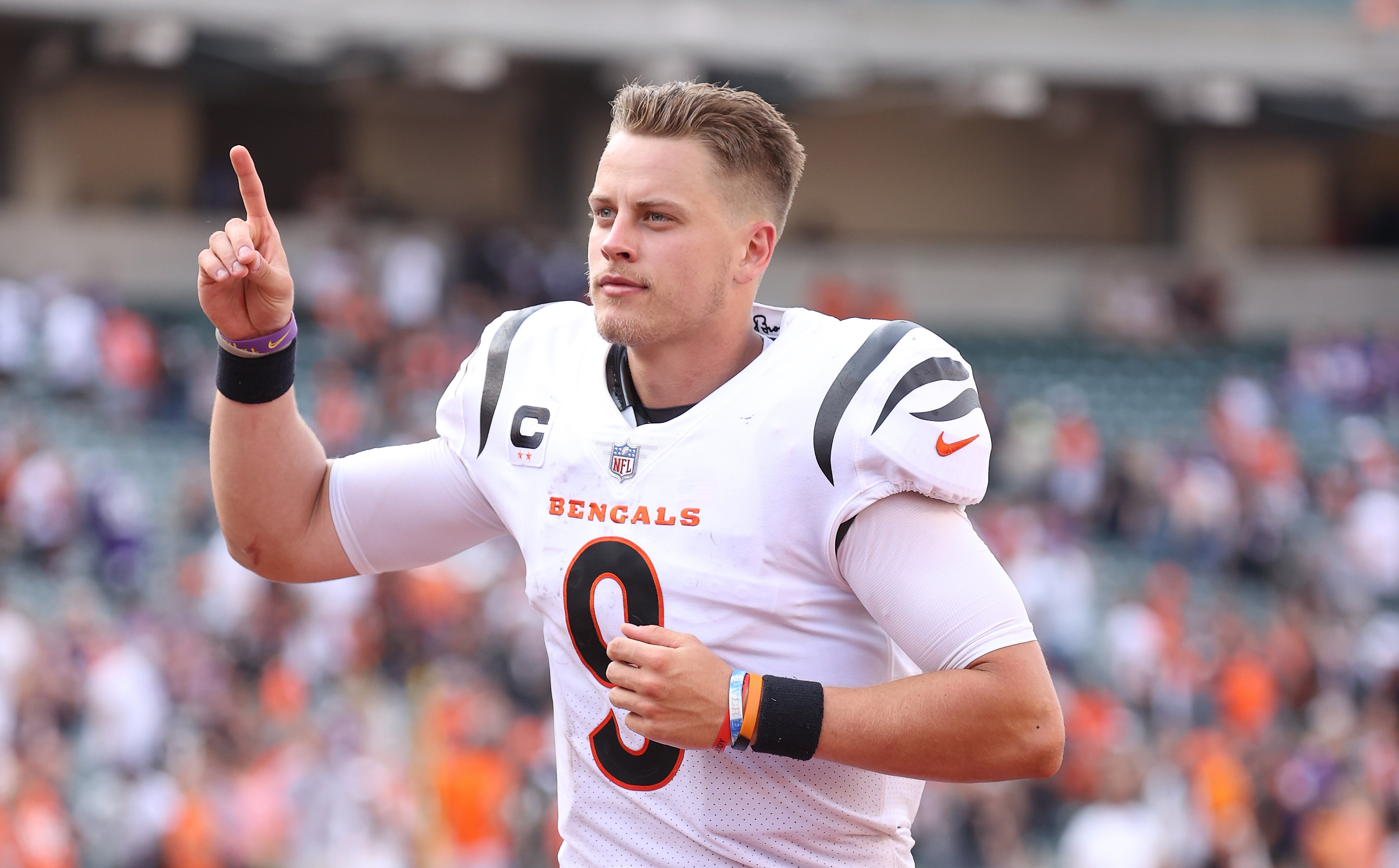 Joe Burrow of the Cincinnati Bengals jogging off the field after beating the Minnesota Vikings in overtime