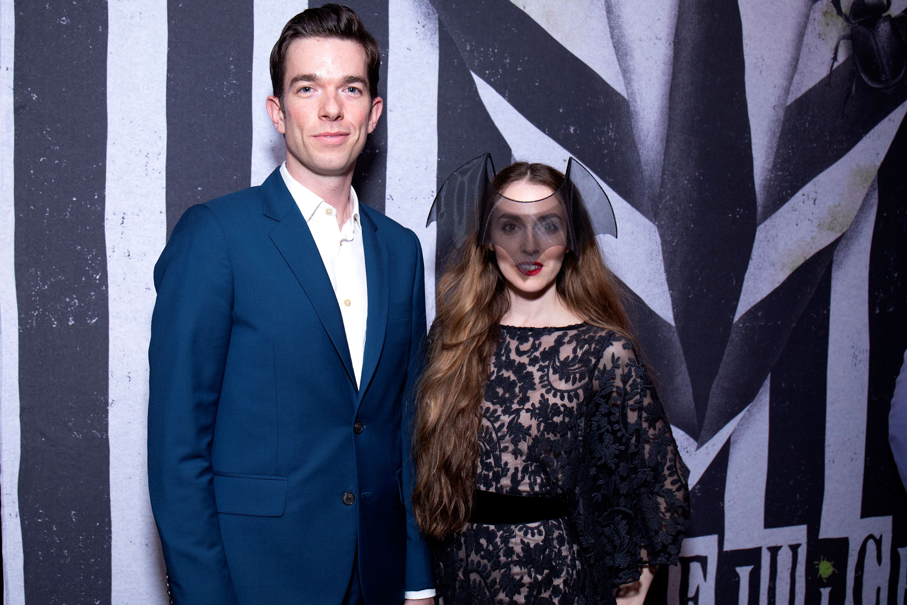 John Mulaney a in blue jacket and Anna Marie Tendler in black