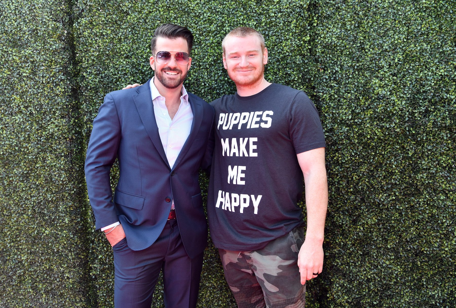 Johnny 'Bananas' Devenanzio and Wes Bergmann from MTV's 'The Challenge' standing next to each other and smiling. Neither player competed on 'The Challenge' Season 37