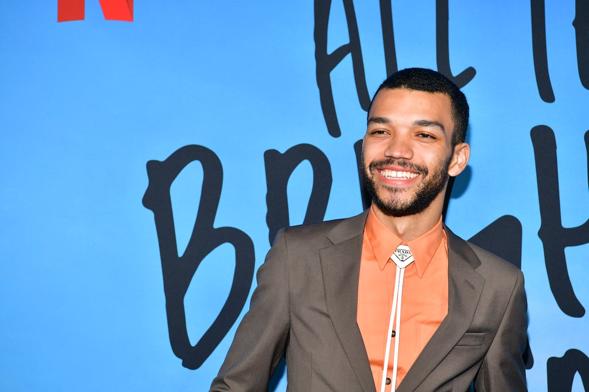 Justice Smith on the red carpet in a suit