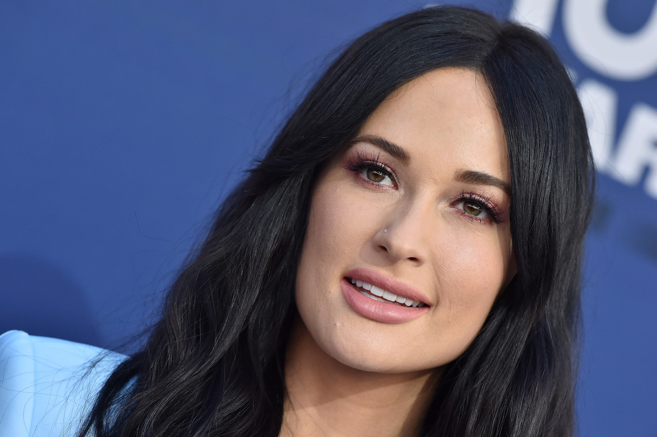 Kacey Musgraves looking on, close up