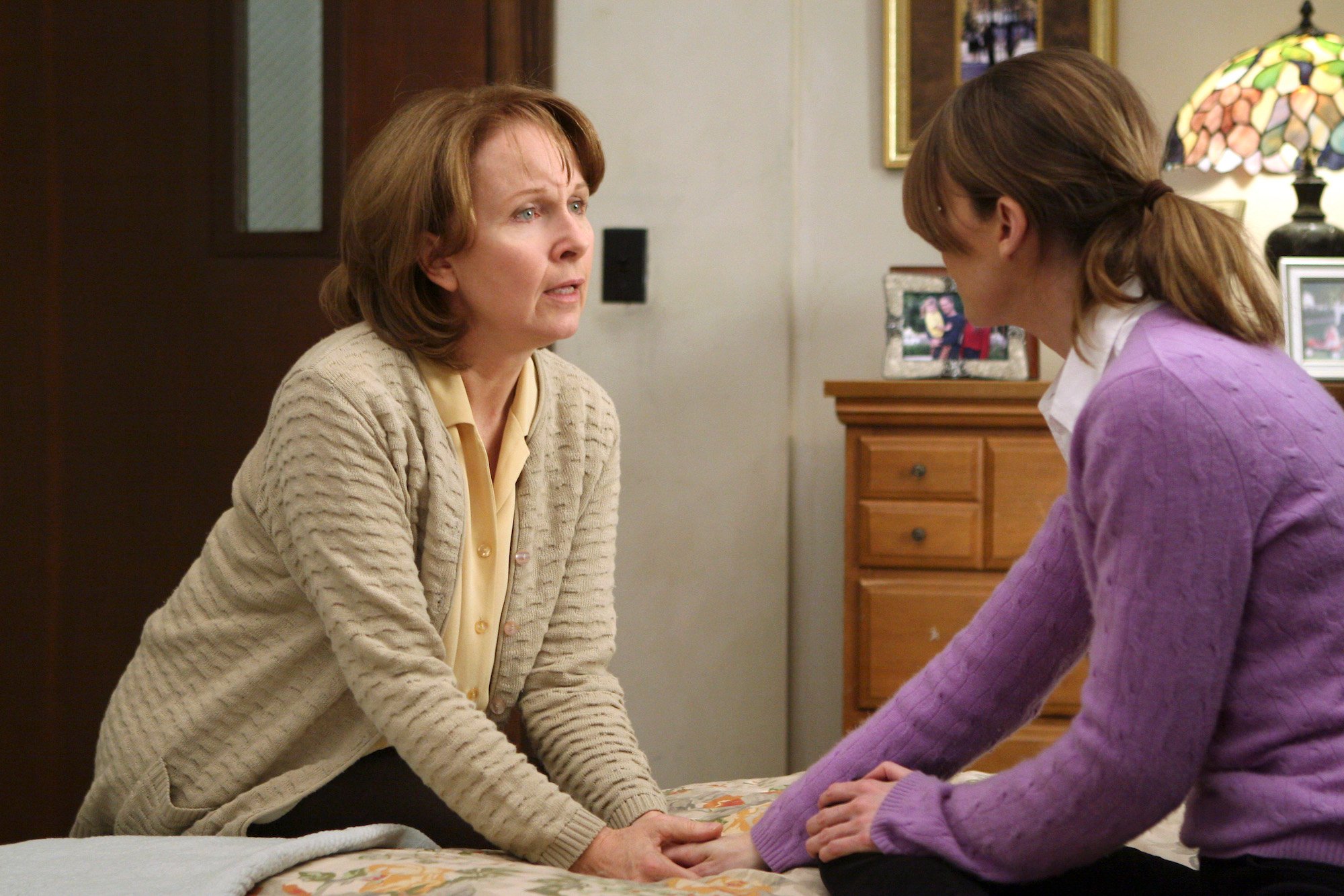 Ellen Pompeo and Kate Burton sitting together on 'Grey's Anatomy.'