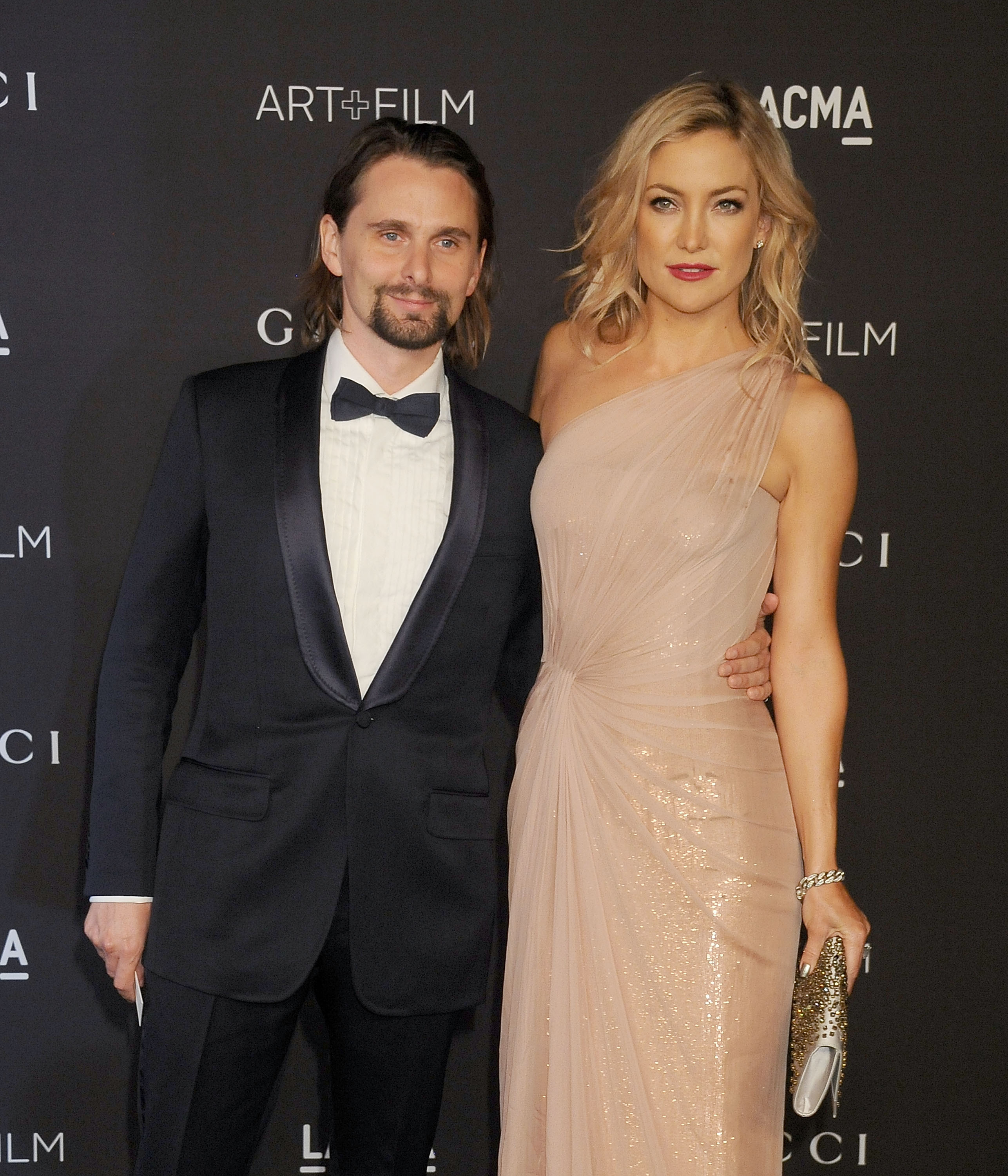 Kate Hudson and musician Matthew Bellamy pose on the red carpet together at the LACMA Art + Film Gala