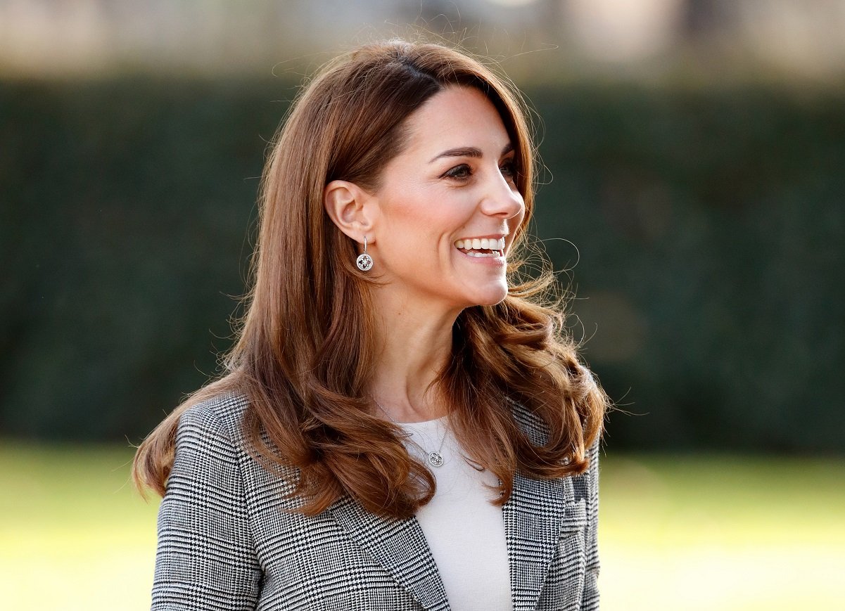 Kate Middleton wearing a plaid blazer and white shirt at the Shout's Crisis Volunteer celebration event