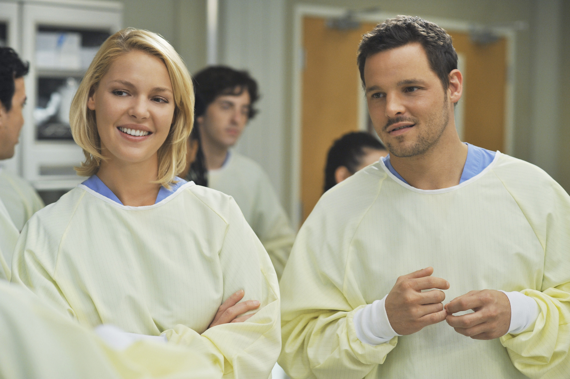 Katherine Heigl, and Justin Chambers dressed in white scrubs from 'Grey's Anatomy'
