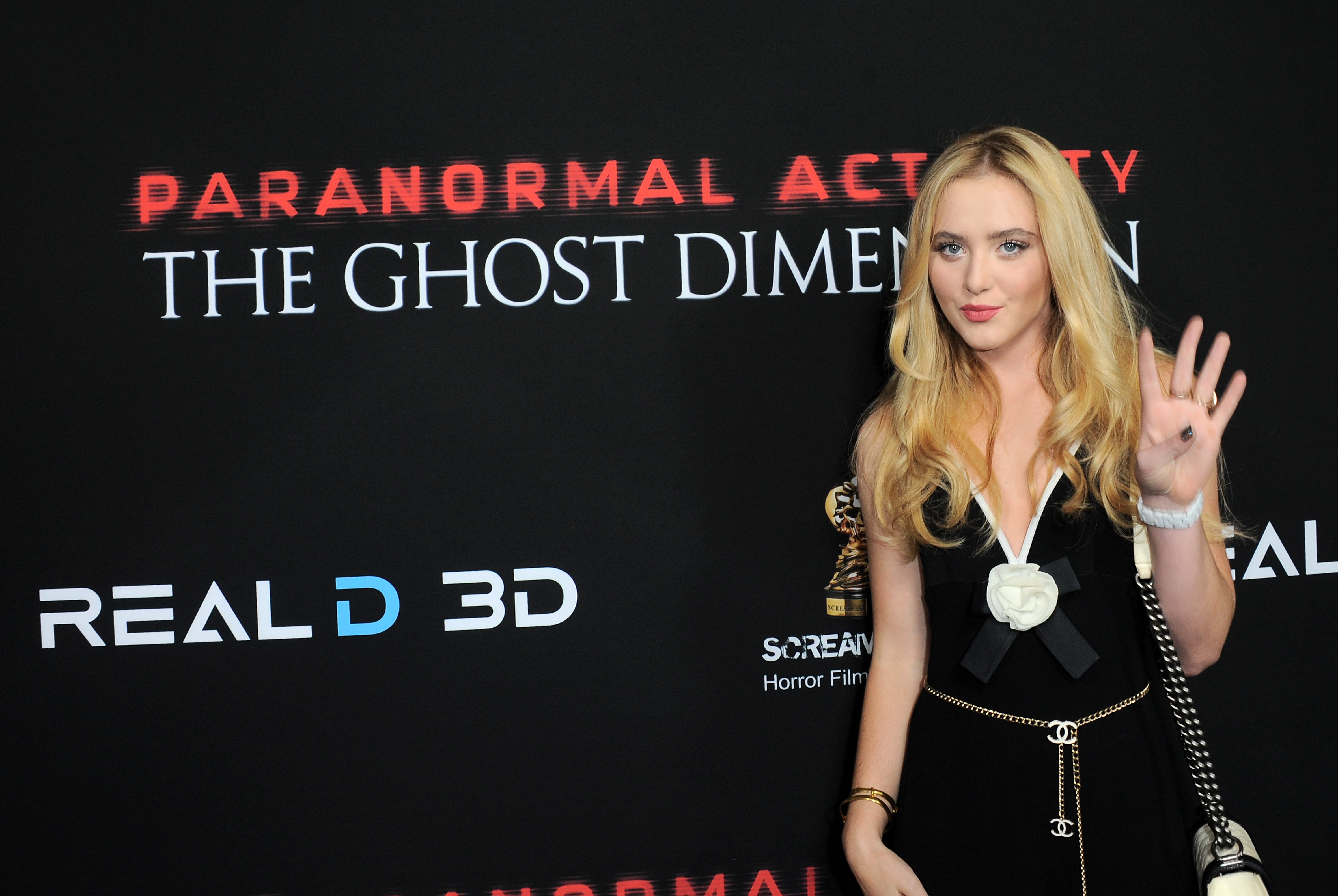 Kathryn Newton standing at Paranormal Activity screening