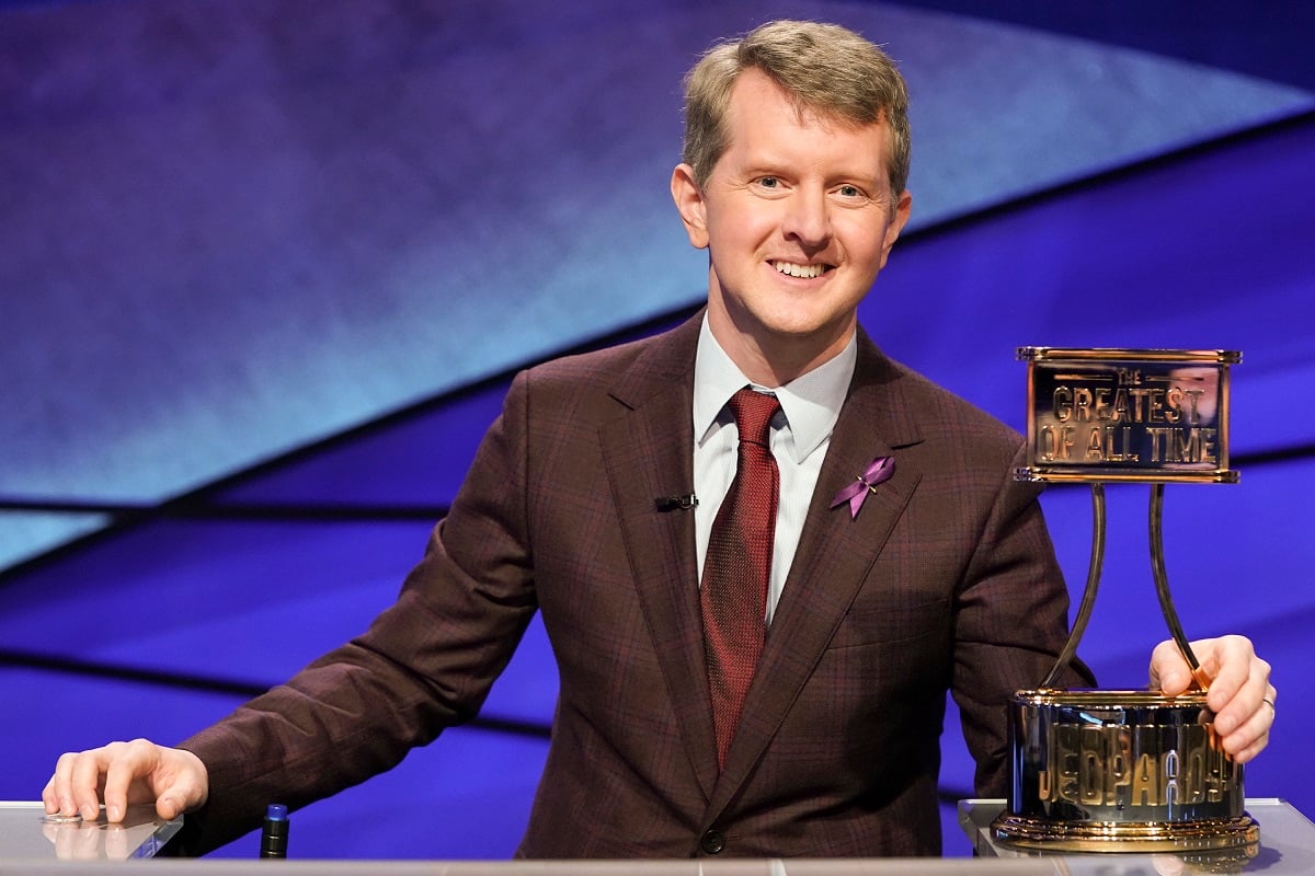 'Jeopardy' contestant Ken Jennings poses with his Greatest of All Time trophy during the Tournament of Champions.