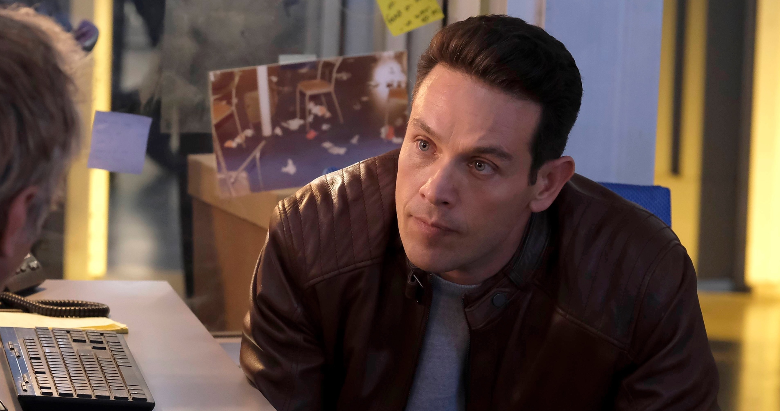 Kevin Alejandro as Dan Espinoza in Netflix's 'Lucifer' wearing brown leather jacket in precinct