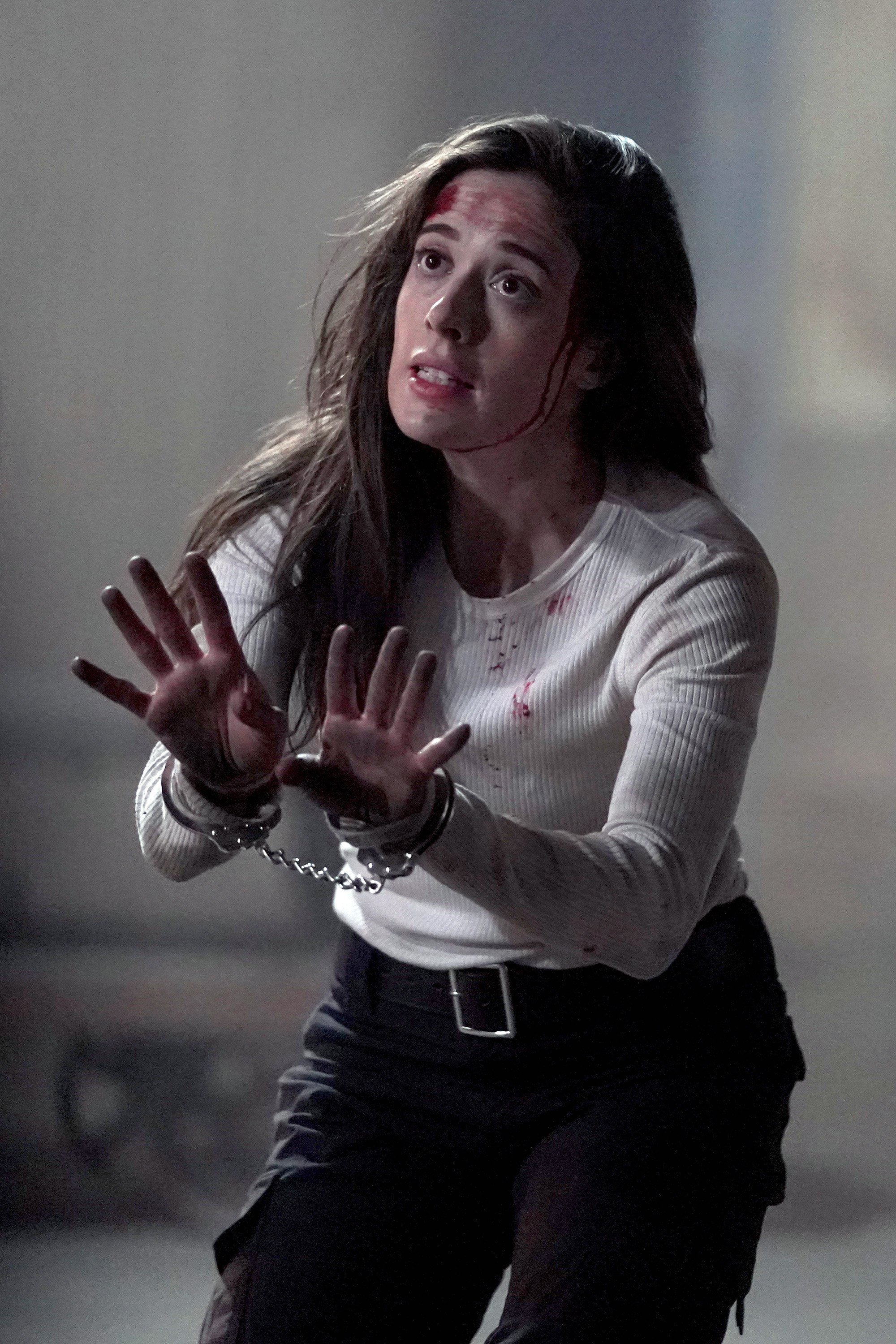 Marina Squerciati as Kim Burgess handcuffed and bleeding in 'Chicago P.D.' Season 8