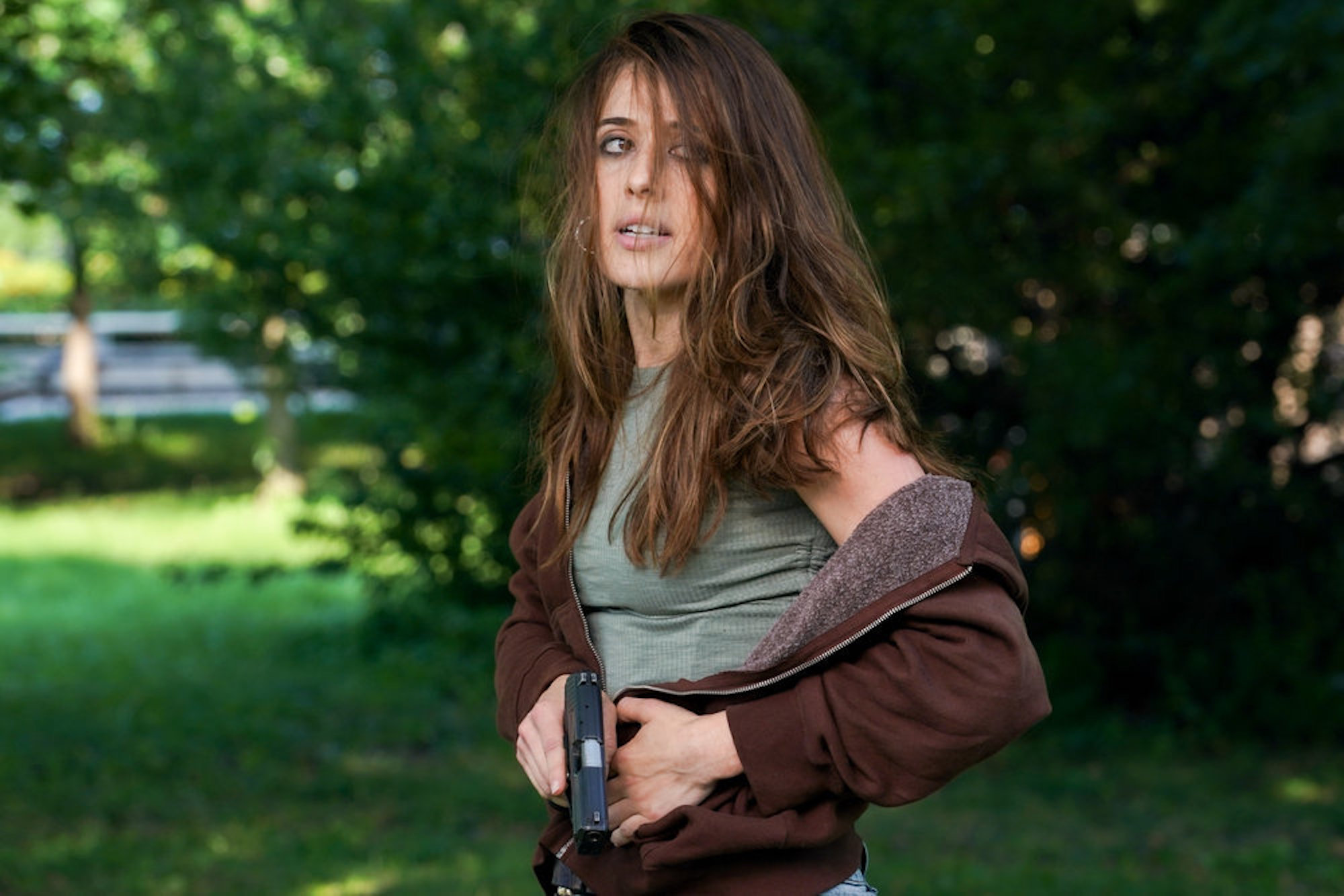 Marina Squerciati as Kim Burgess holding a gun outside in 'Chicago P.D.' Season 9 Episode 2