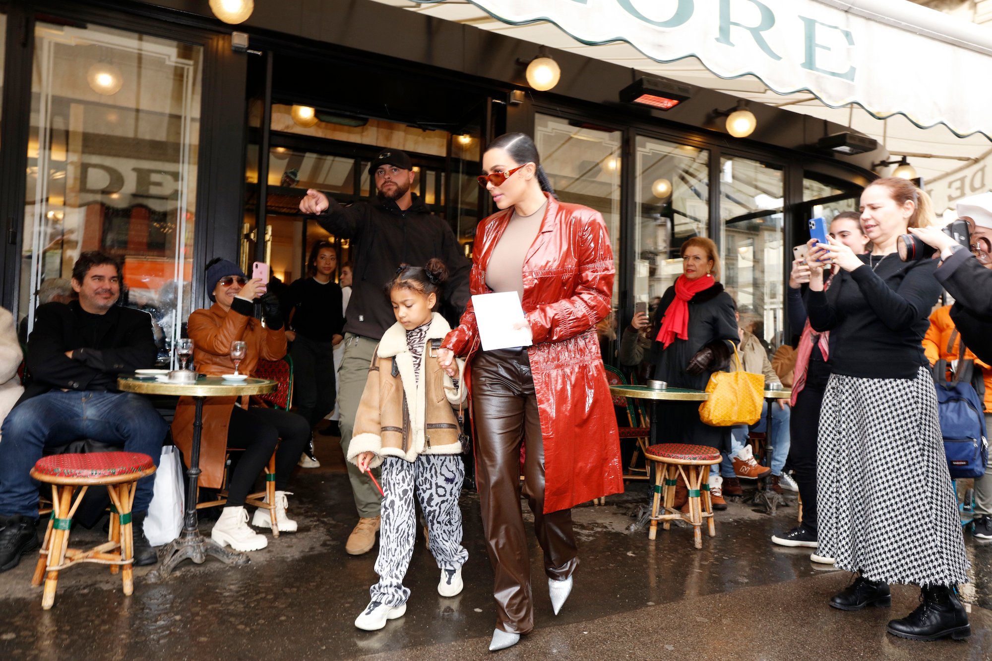Kim Kardashian and North West walking out of a cafe in Paris