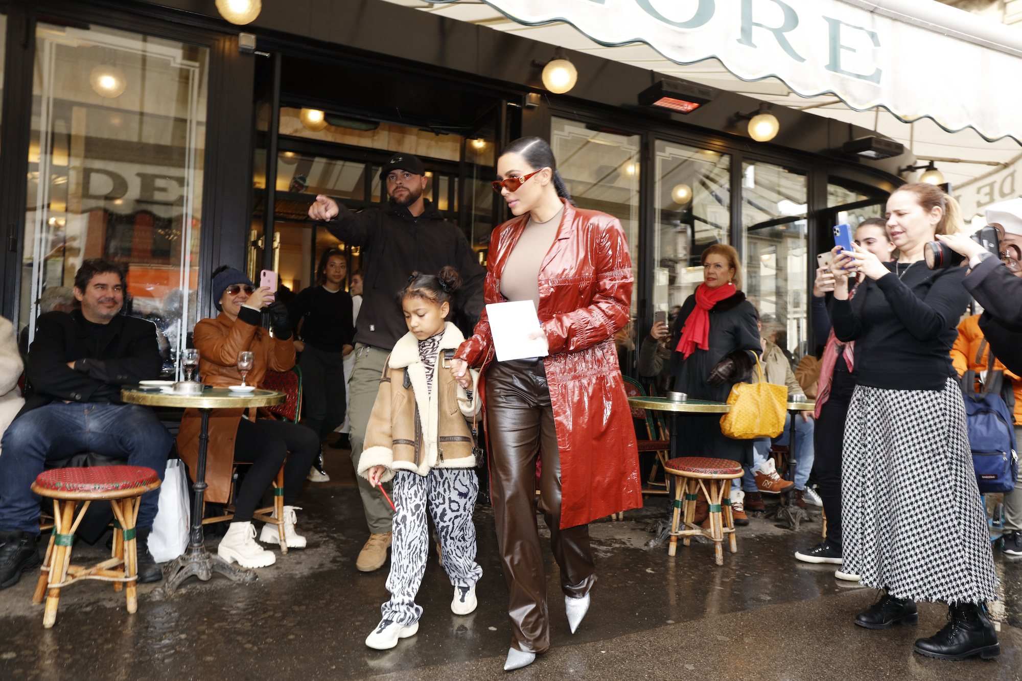 Kim Kardashian and North West walking out of a cafe in Paris