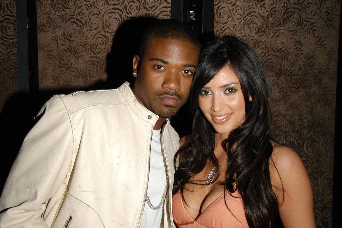 Ray J and Kim Kardashian pose together at an event.