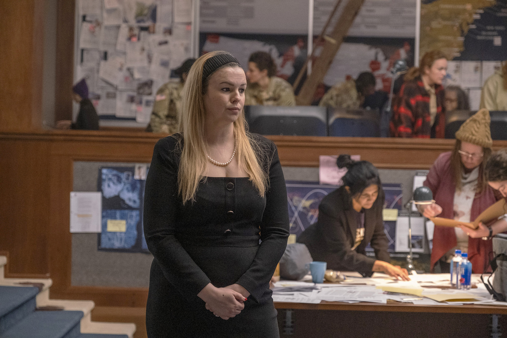 Kimberly Cunningham (Amber Tamblyn) stands with her hands folded