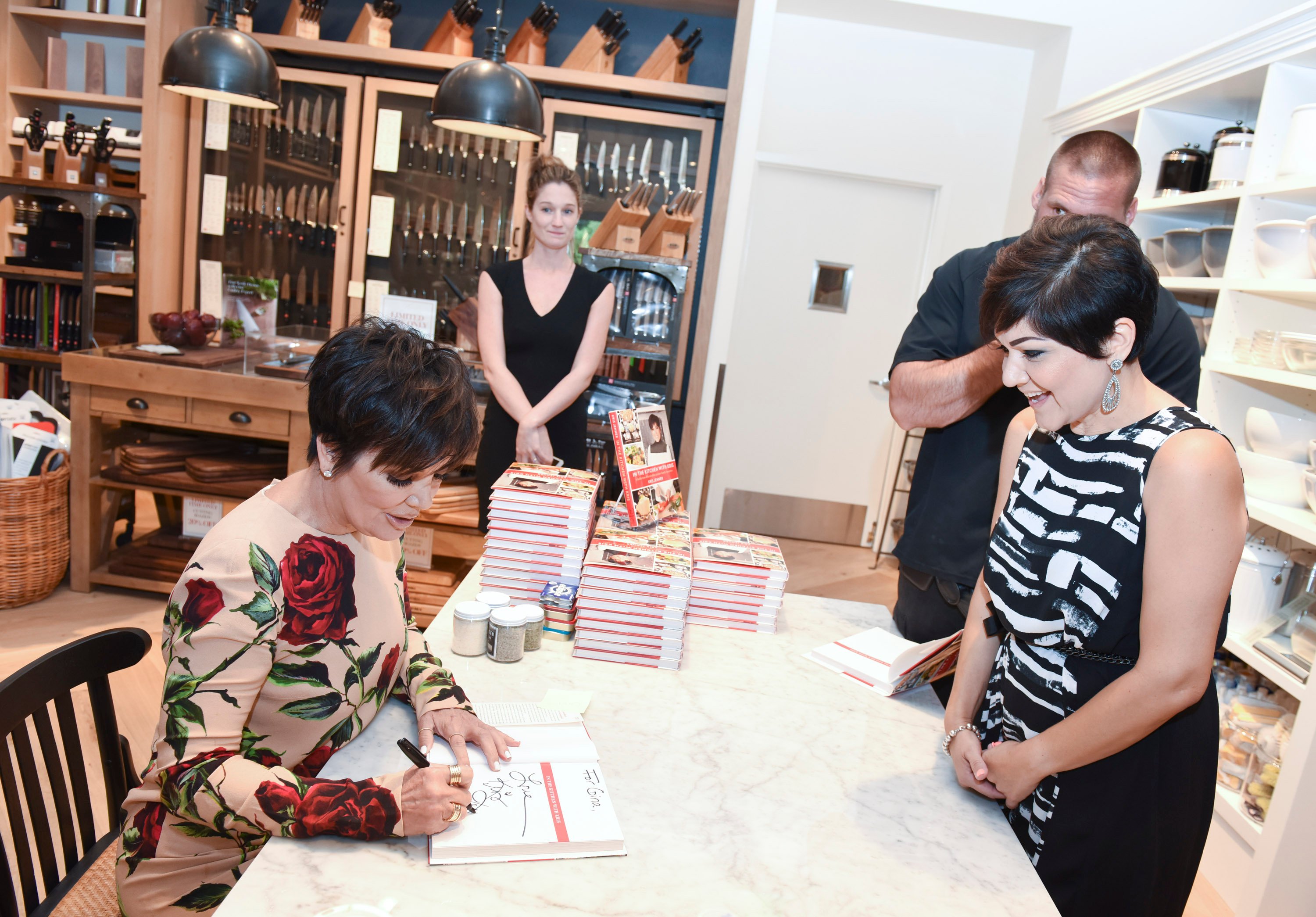 Kris Jenner signing her cookbook at an event in 2014.