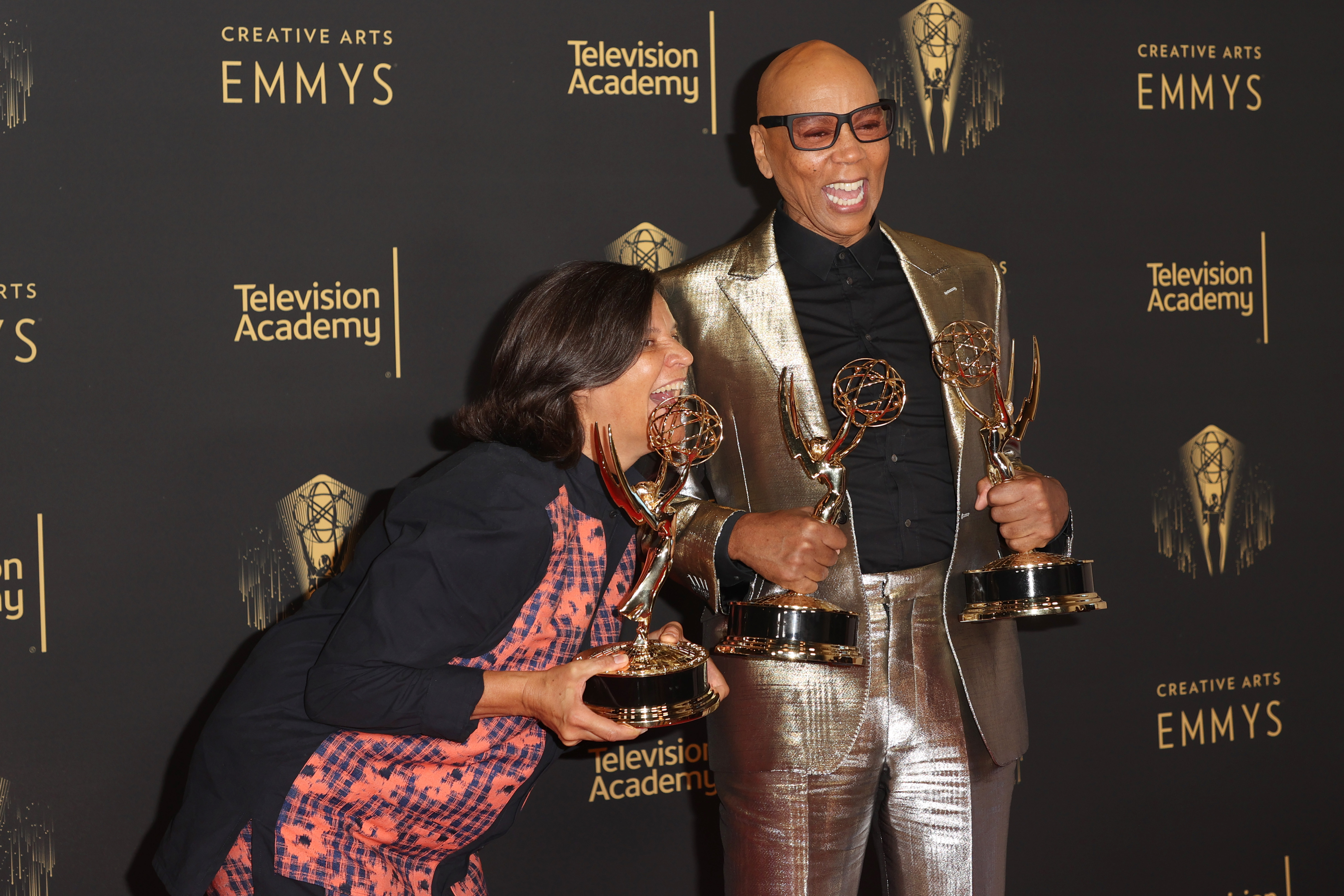 Kristen Johnson and RuPaul pose with the awards at the Creative Arts Emmys