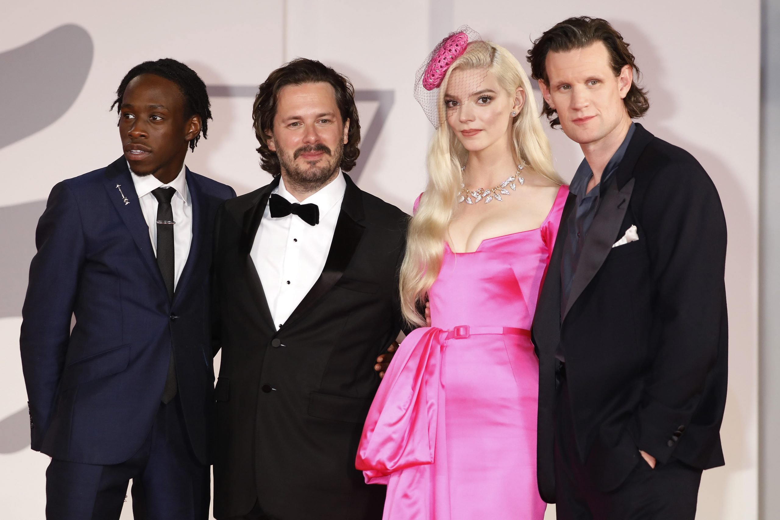 Cast of Last Night in Soho stand together for a group photo at the red carpet