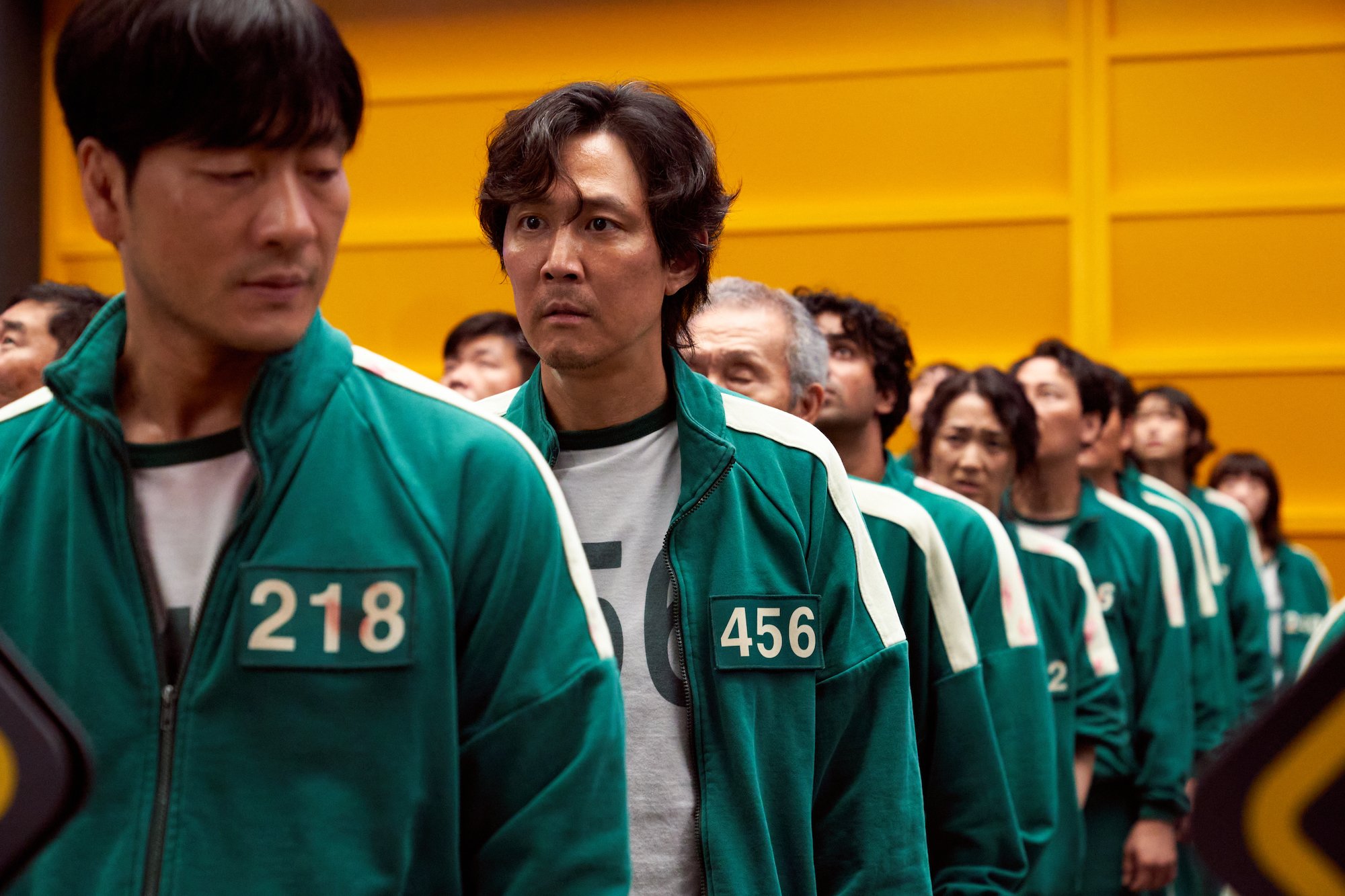 Actor Lee Jung-jae standing in line in 'Squid Game' Season 1