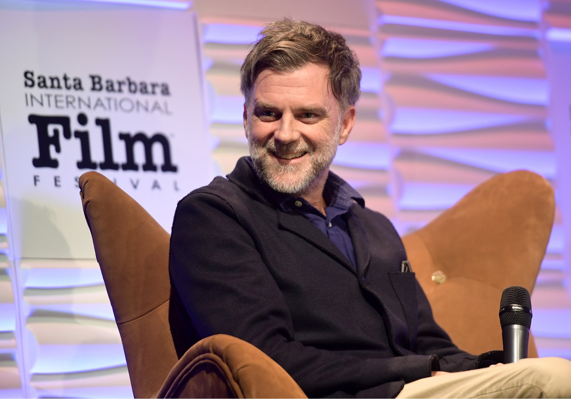 'Licorice Pizza' director Paul Thomas Anderson smiling with a microphone at the Santa Barbara International Film Festival