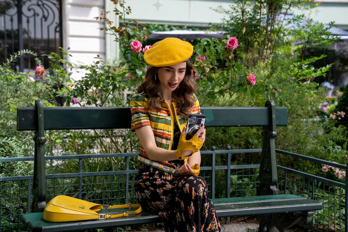 Lily Collins dressed in a yellow dress in 'Emily in Paris' Season 2.