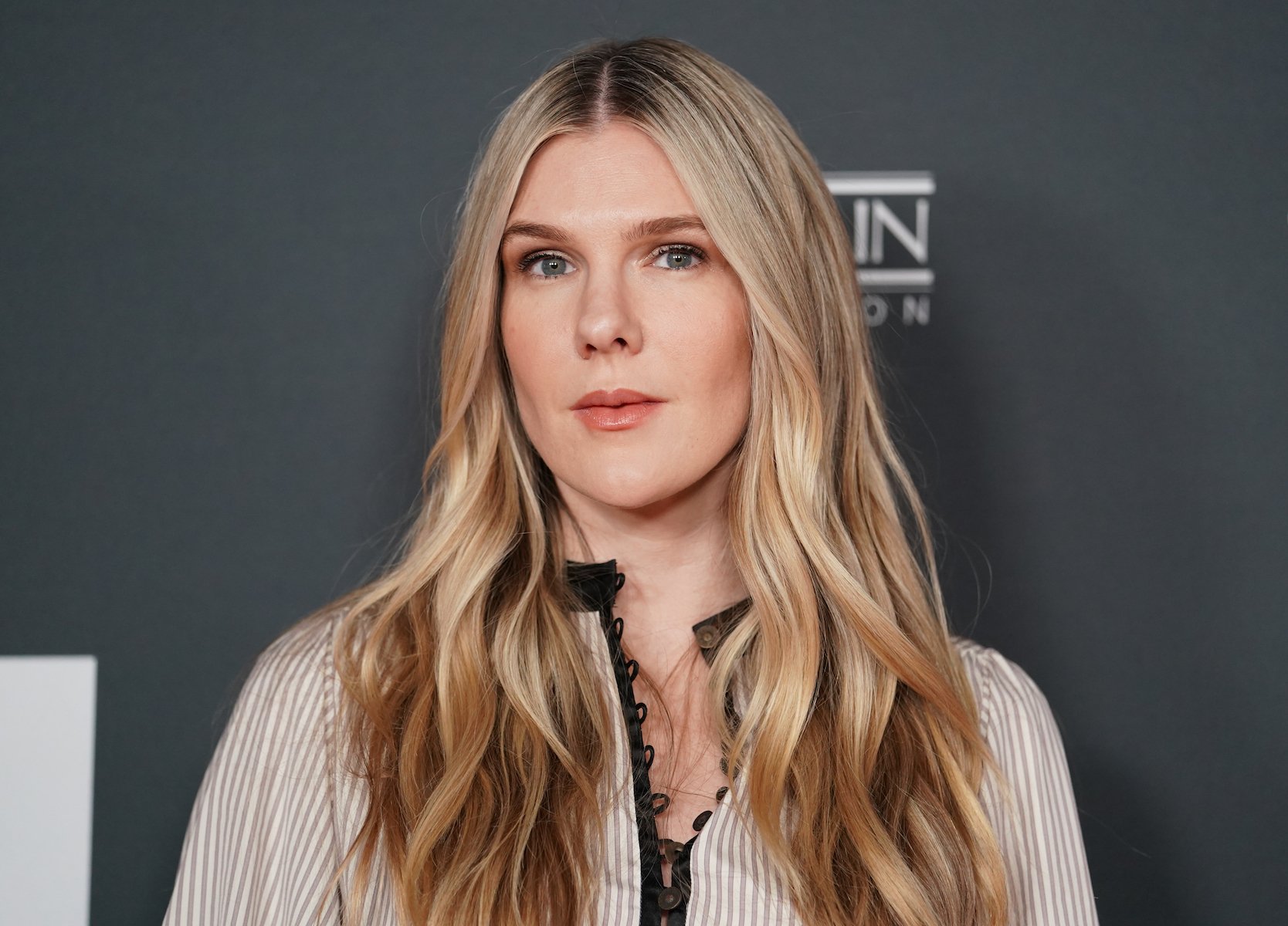 'American Horror Story' Season 10 star Lily Rabe close-up against a black background
