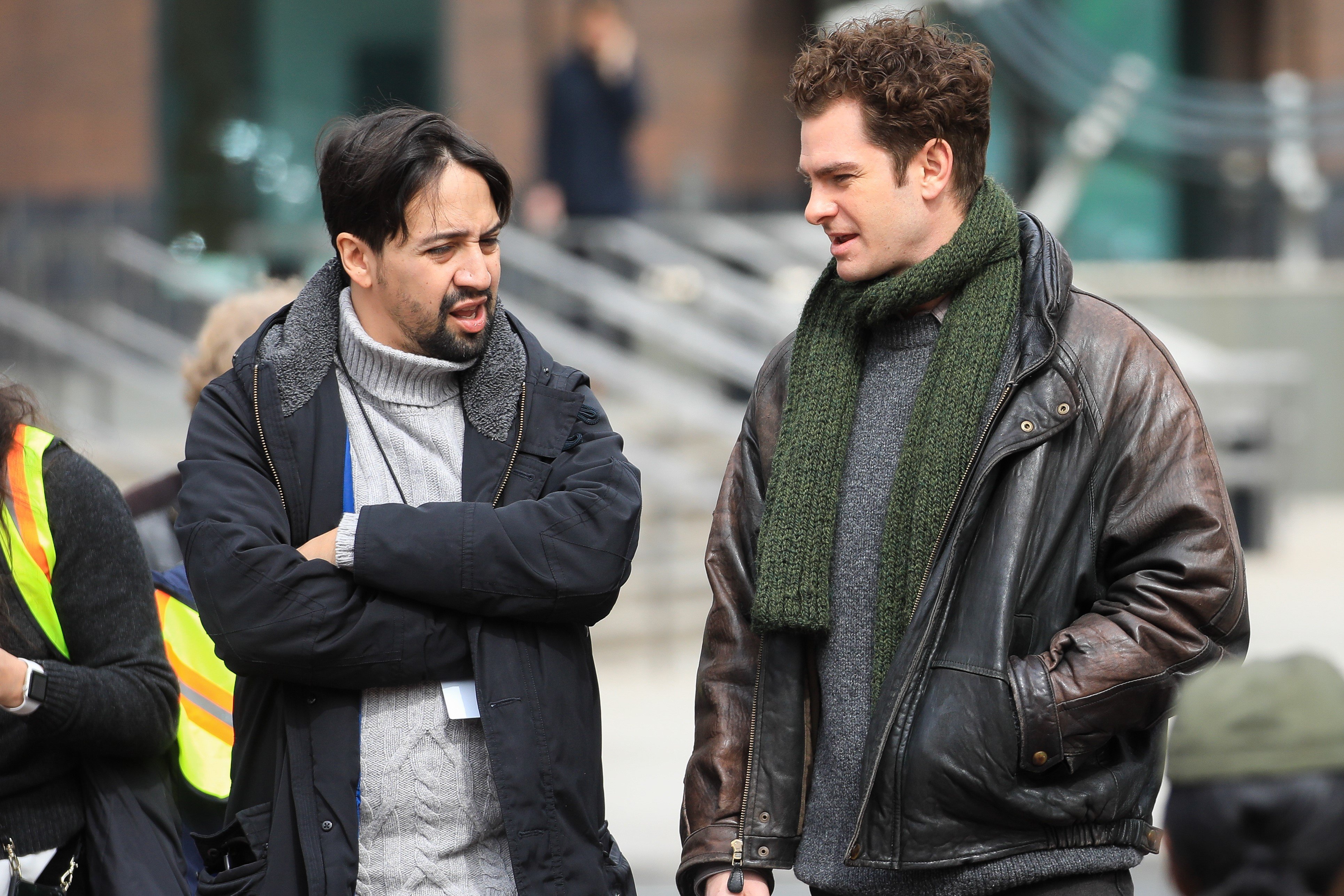 Lin Manuel Miranda, in a grey sweater and black jacket, and Andrew Garfield, in a grey sweater, green neck stole and jacket, on the sets of the film 'Tick Tick... Boom!'