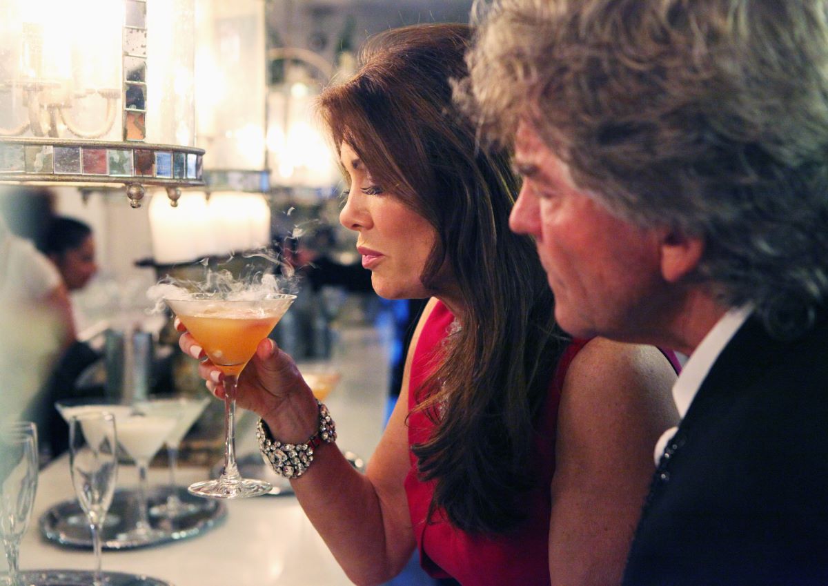 Lisa Vanderpump with a drink and 
her husband, Ken Todd.