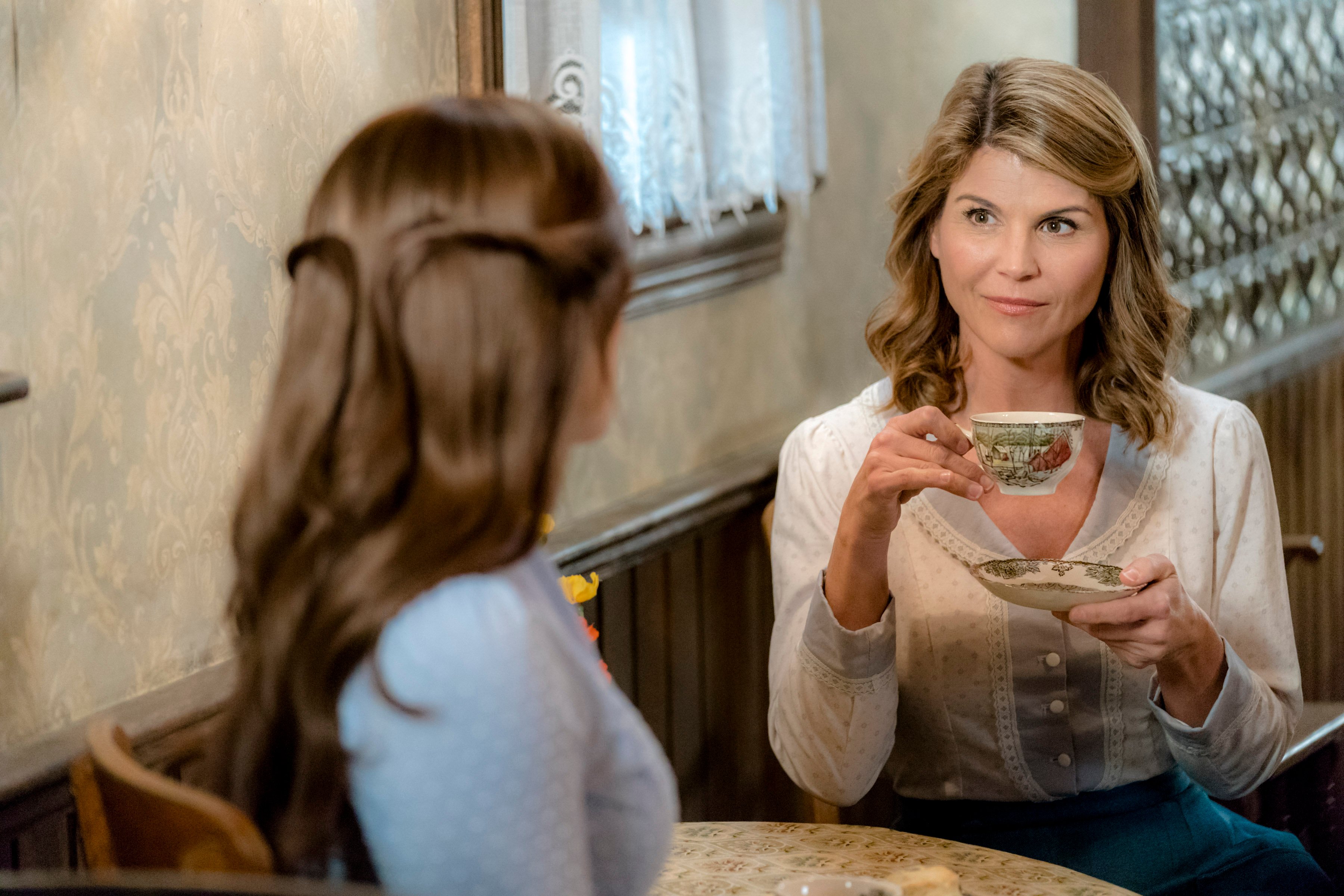 Lori Loughlin as Abigail, holding a teacup, in 'When Calls the Heart' Season 5