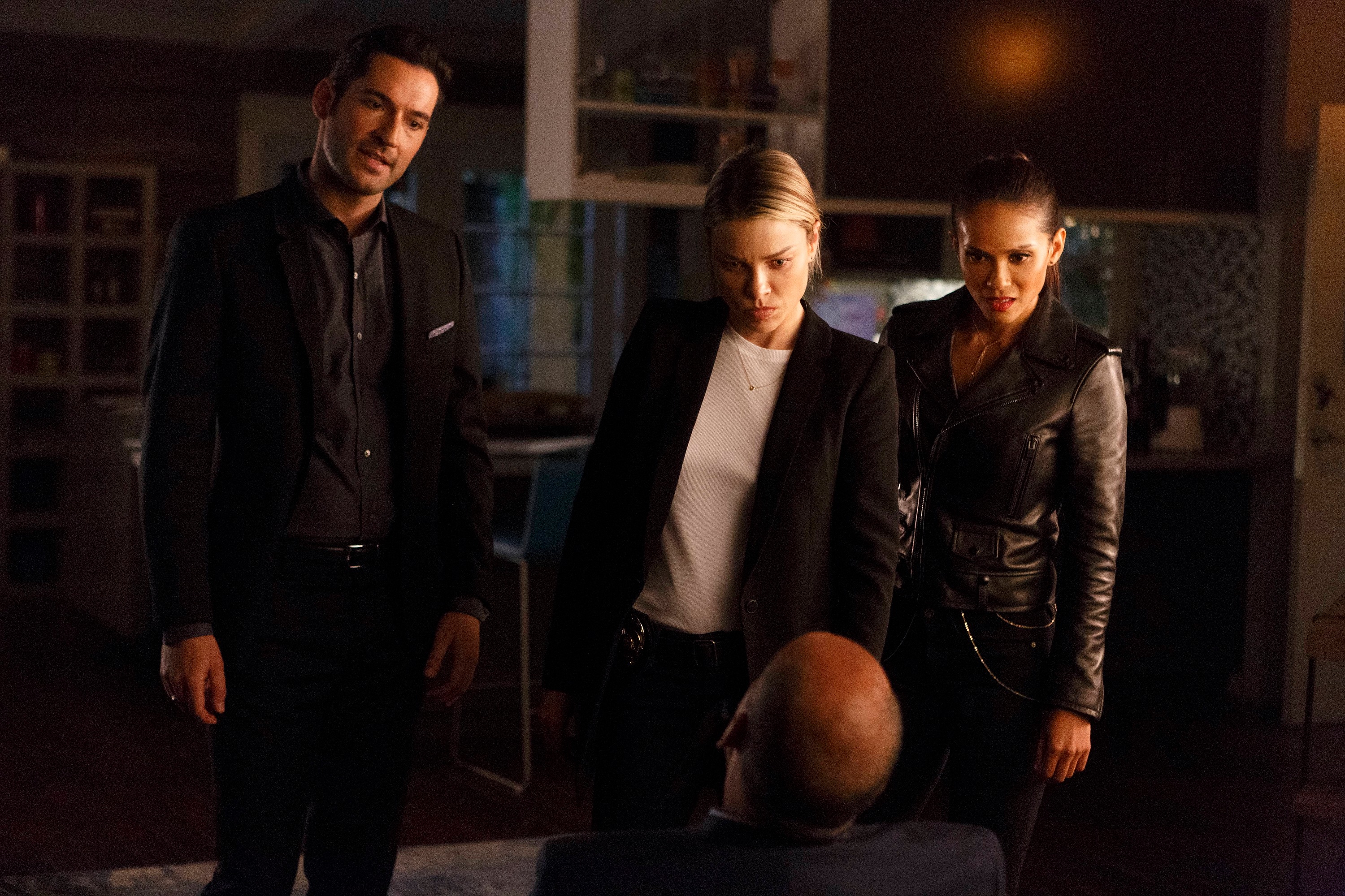Lucifer, Chloe and Maze of 'Lucifer' looking at a suspect