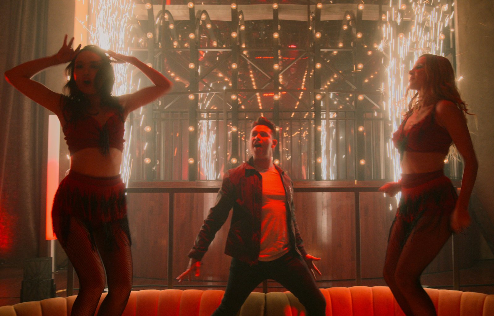 A musical moment from 'Lucifer' Season 5 Episode 10. Dan (Kevin Alejandro) is dancing, as are two women on either side of him.