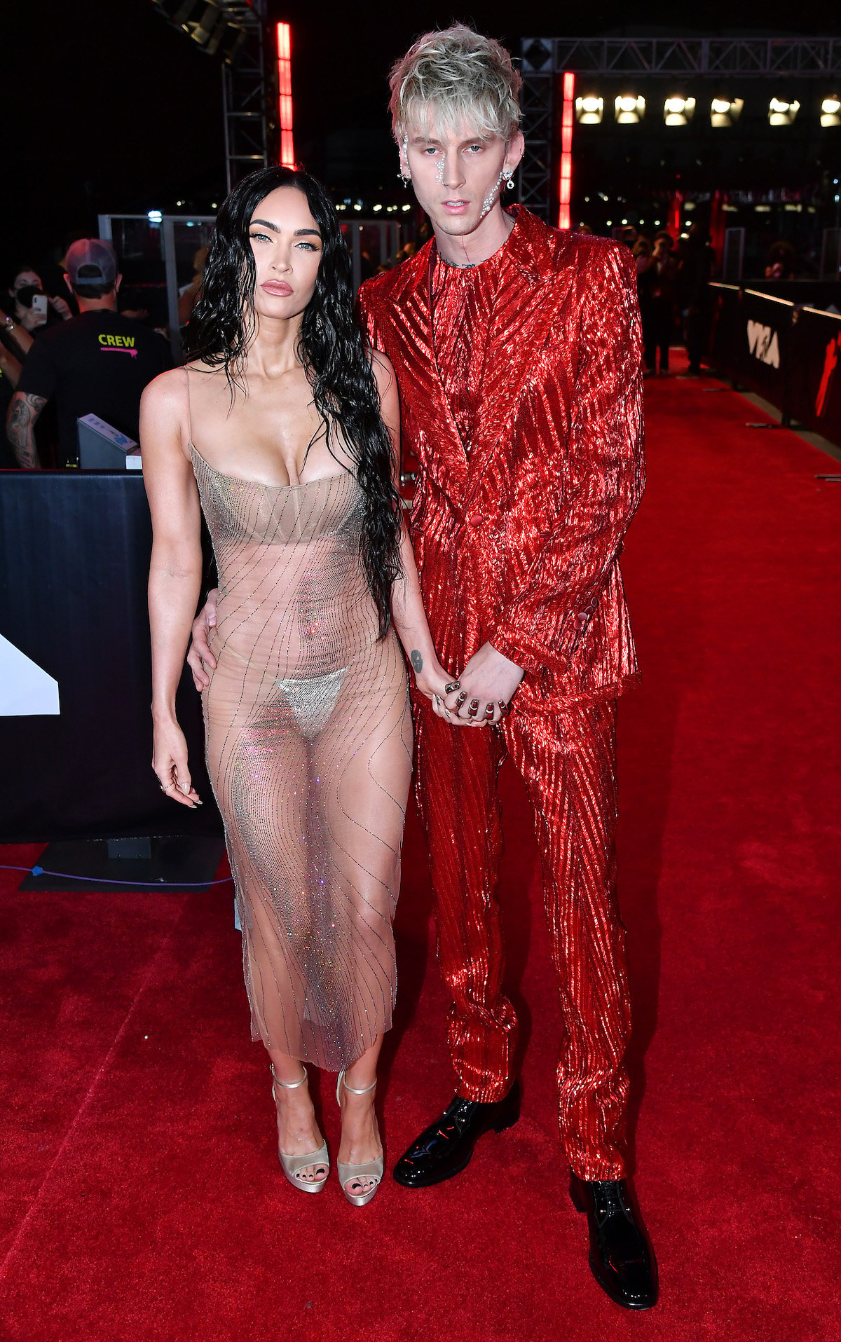 Megan Fox and Machine Gun Kelly pose together on the VMAs red carpet.