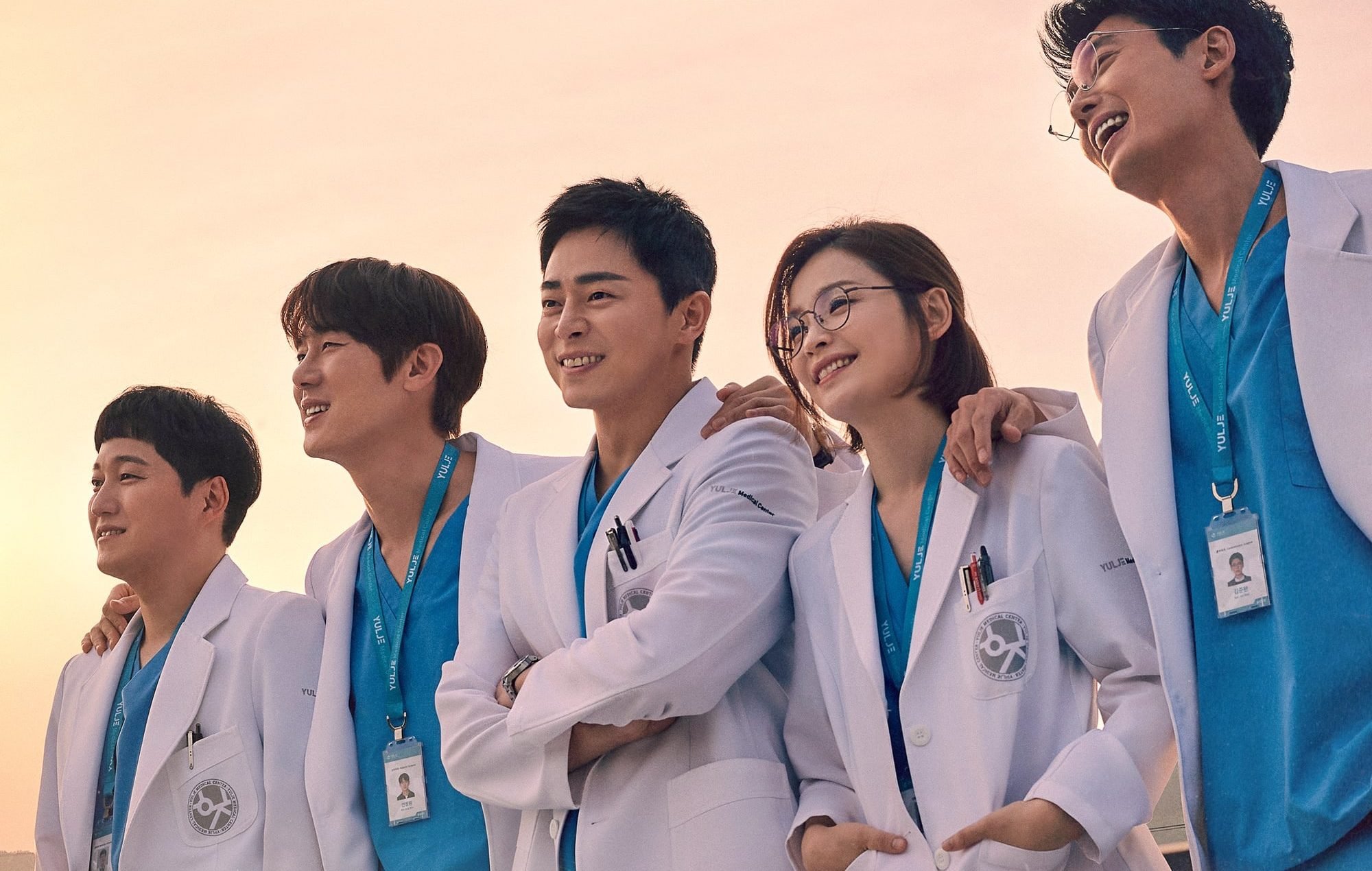 Main cast of 'Hospital Playlist 2' outside wearing medical scrubs