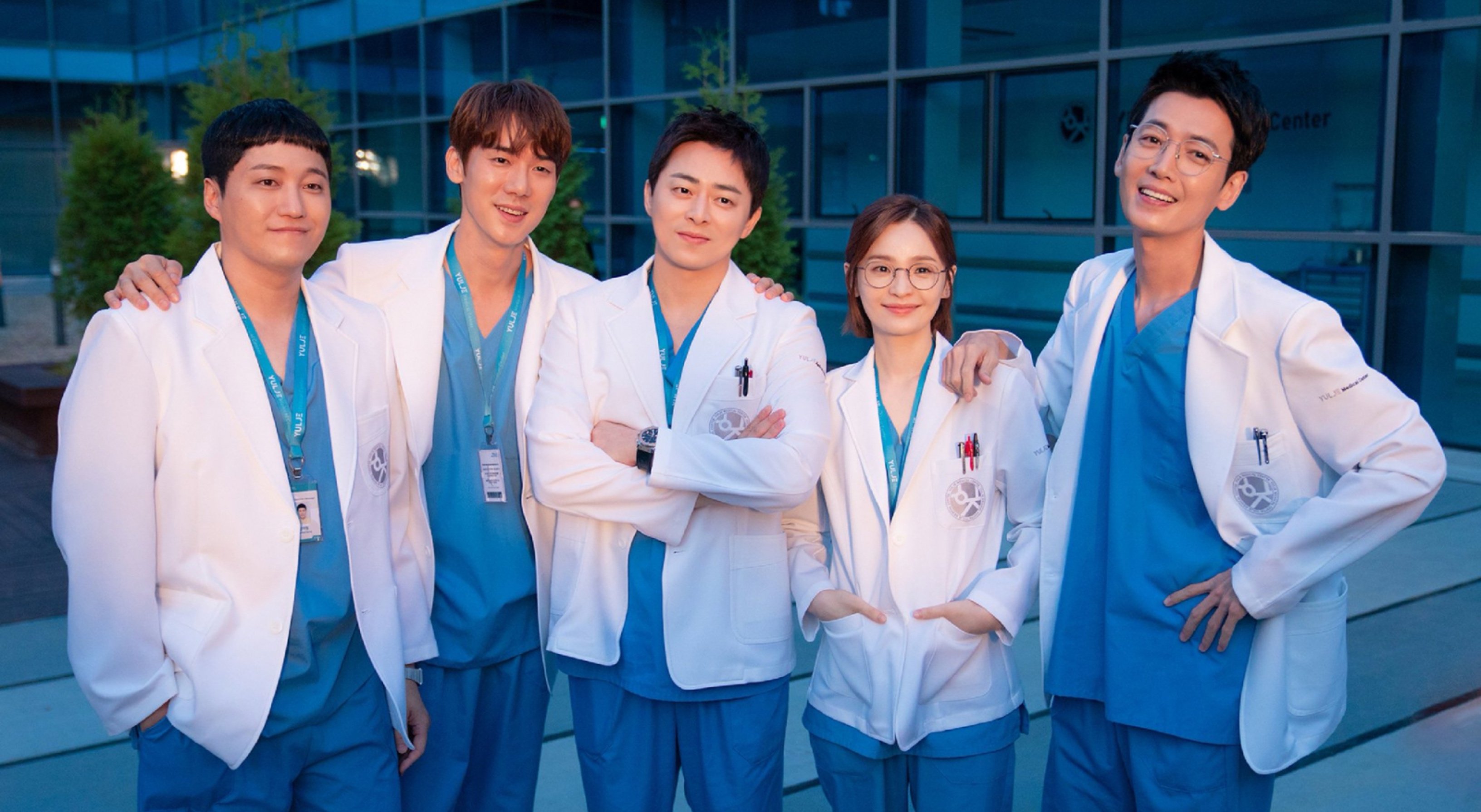 Main characters of 'Hospital Playlist 2' promo poster wearing scrubs in front of hospital