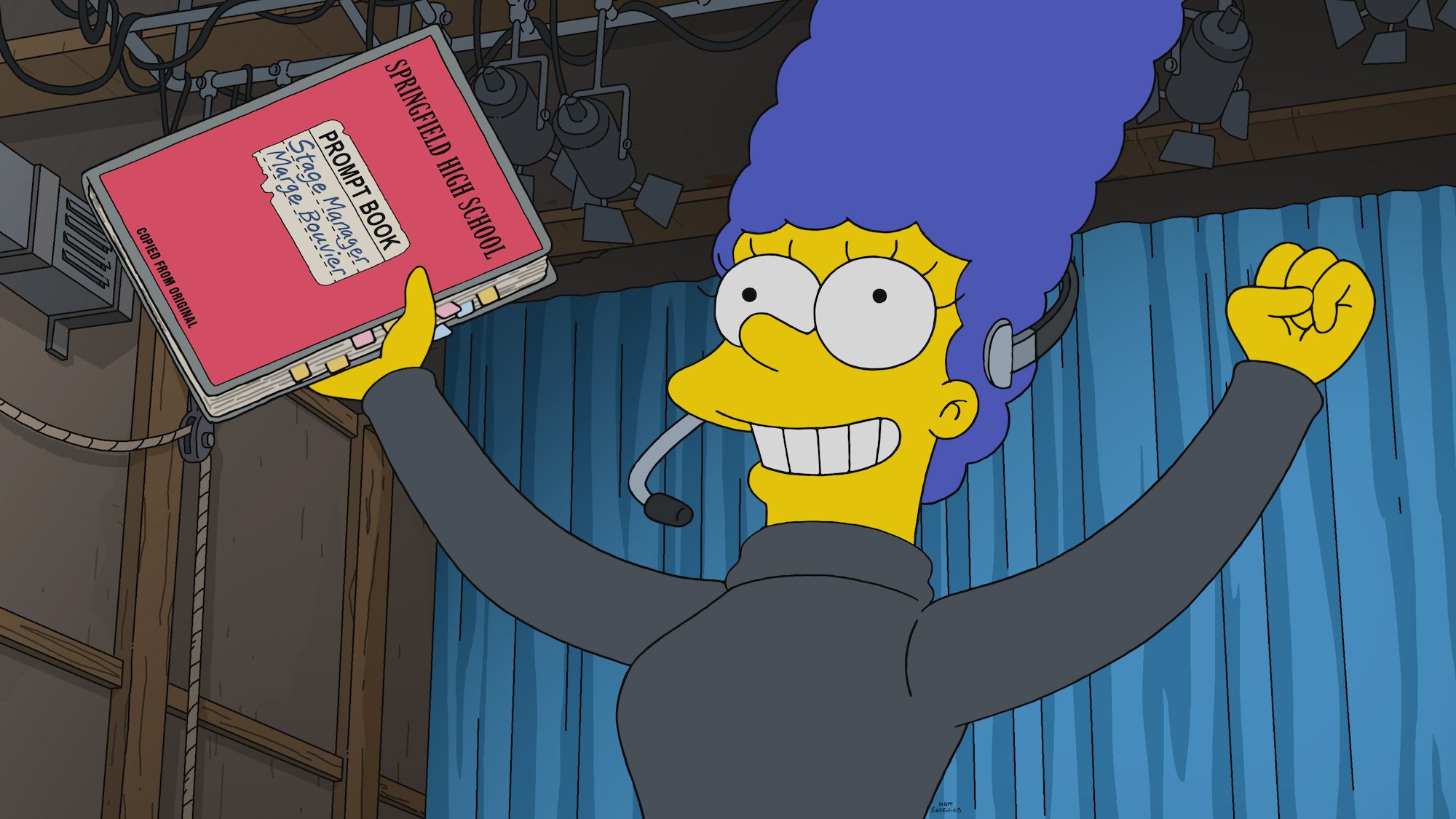 Marge Simpson raises her stage manager prompt book and sings with Kristen Bell's voice