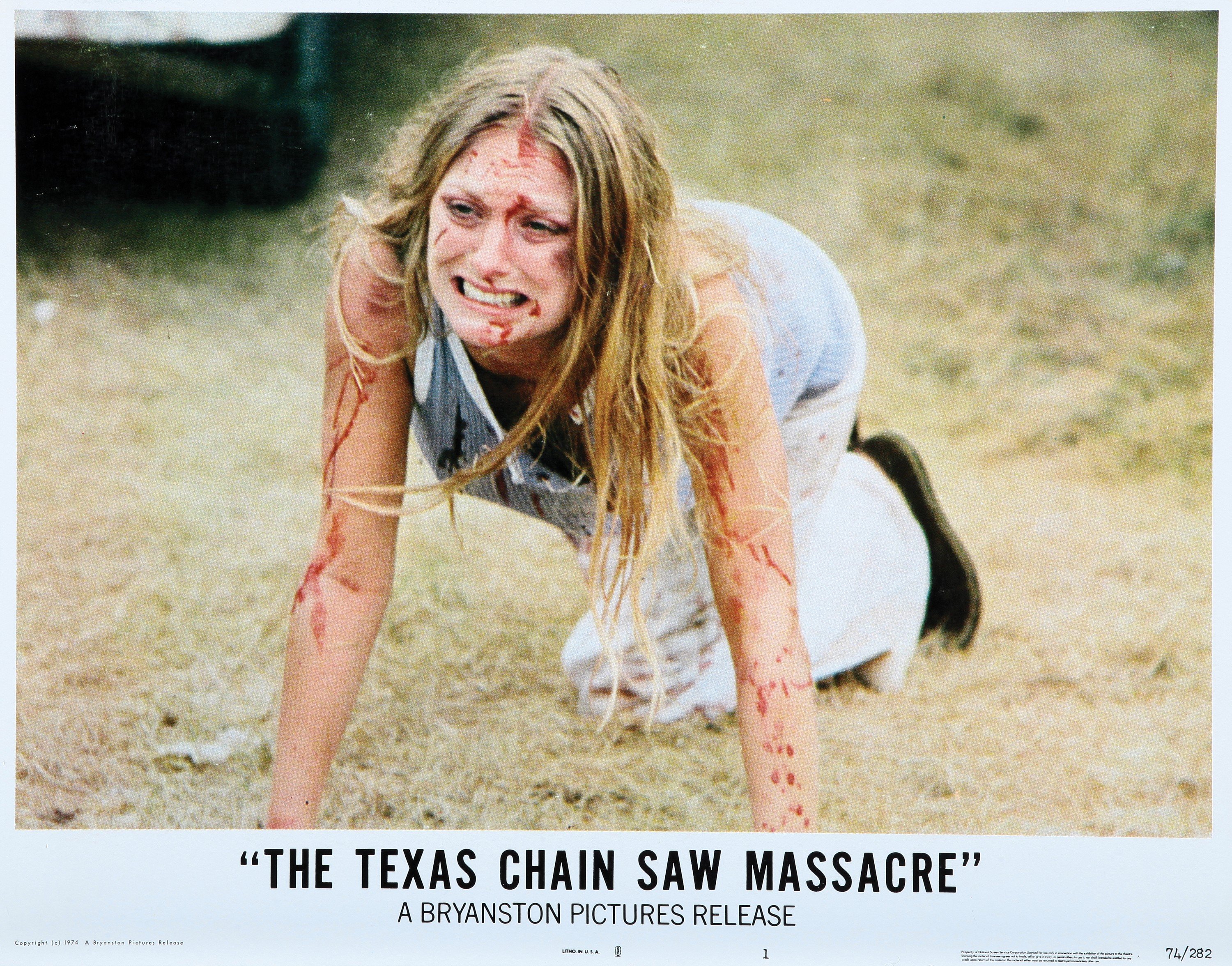 Marilyn Burns crawling on grass in Texas Chainsaw Massacre 1974