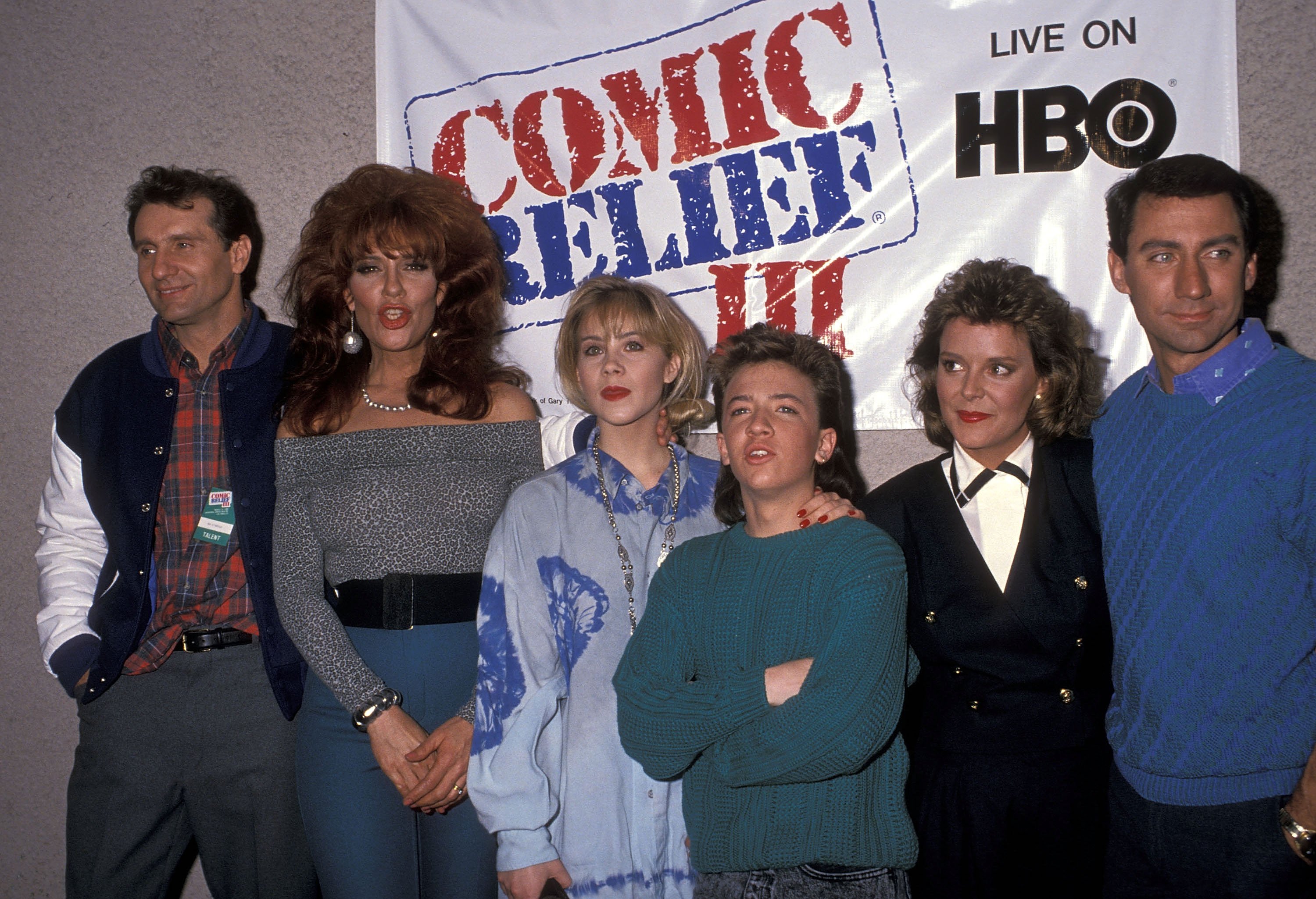 The cast of 'Married...with Children' post for a photo backstage at the 1989 HBO special 'Comic Relief.'