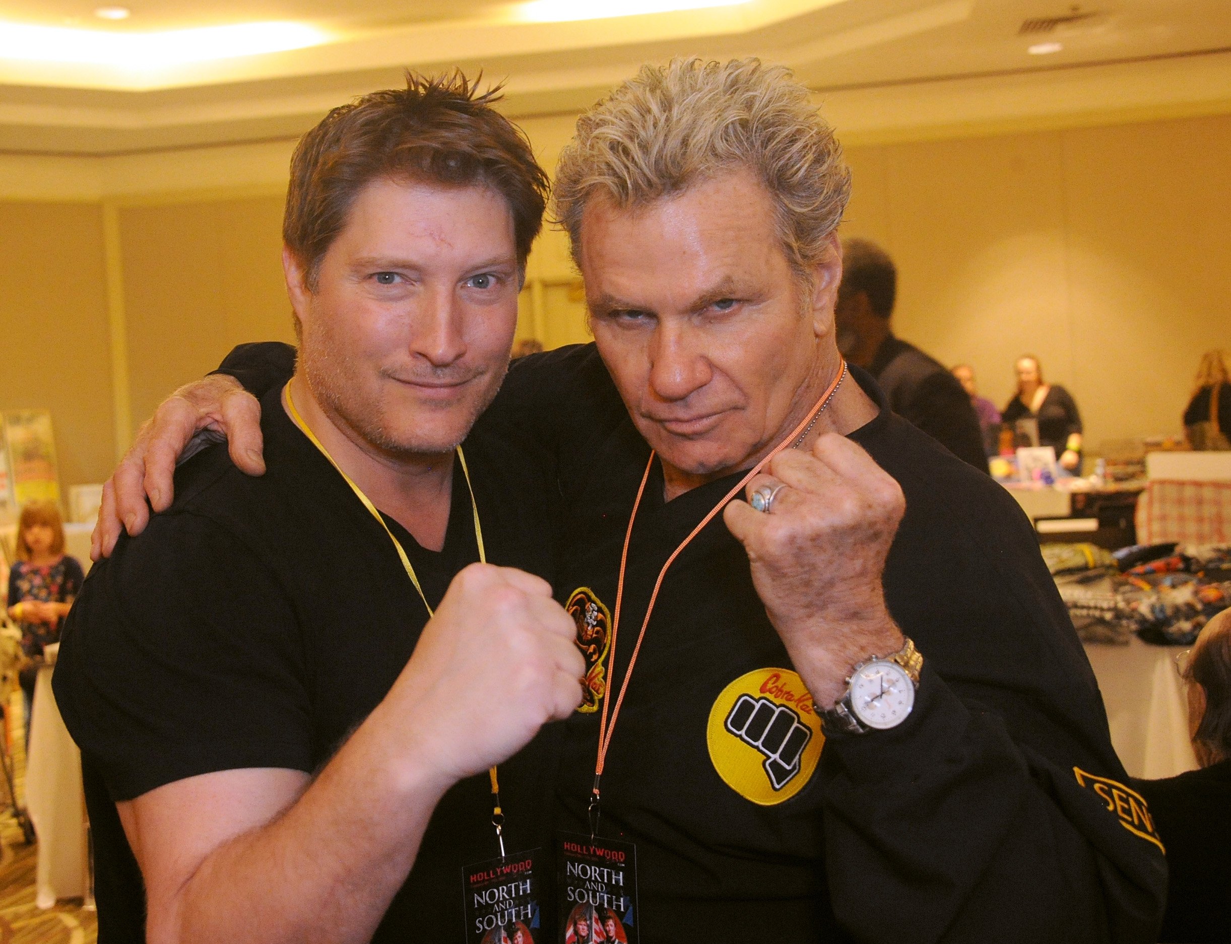 Martin Kove and Sean Kanan pose with their fists