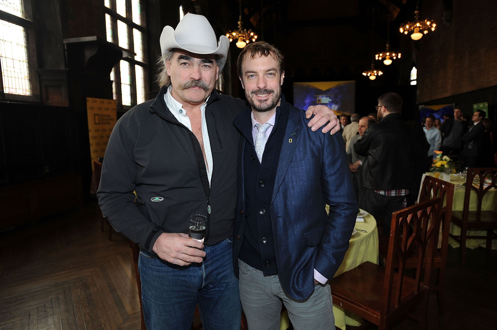 Marty Raney, a member of the 'Homestead Rescue' cast, with his arm around Barton Seaver at a National Geographic event