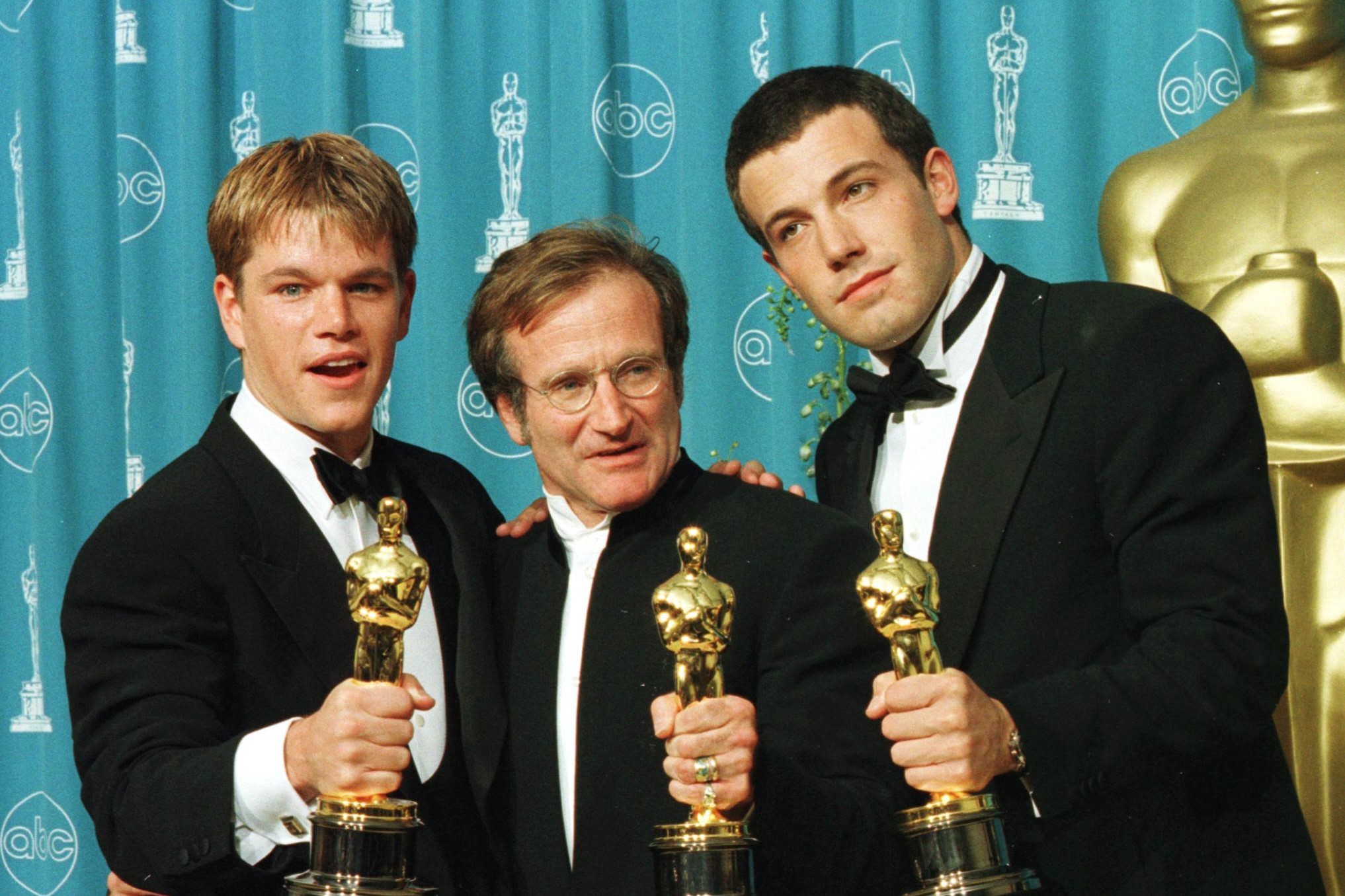 Matt Damon, Robin Williams and Ben Affleck celebrate their Oscar wins for the movie 'Good Will Hunting.' Damon and Affleck won the Academy Award for Best Original Screenplay and Williams won for Best Supporting Actor.
