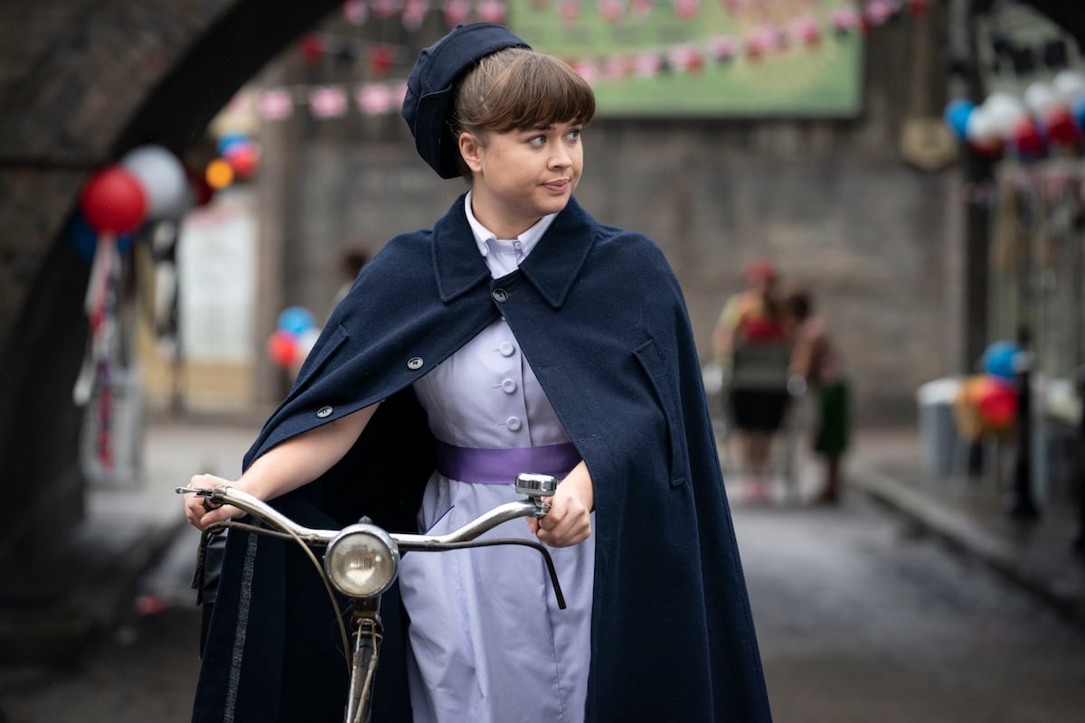 Megan Cusack as Nancy Corrigan with her bicycle in 'Call the Midwife' Season 10