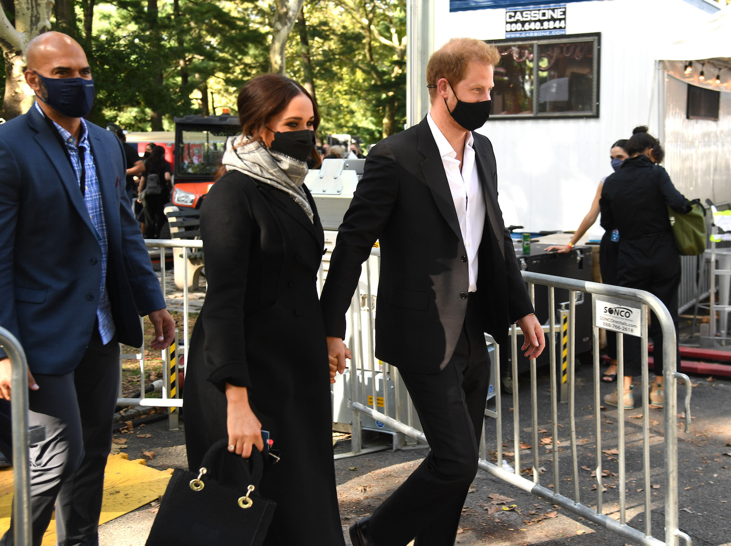 Meghan Markle and Prince Harry arrive at Global Citizen Live wearing face masks and holding hands