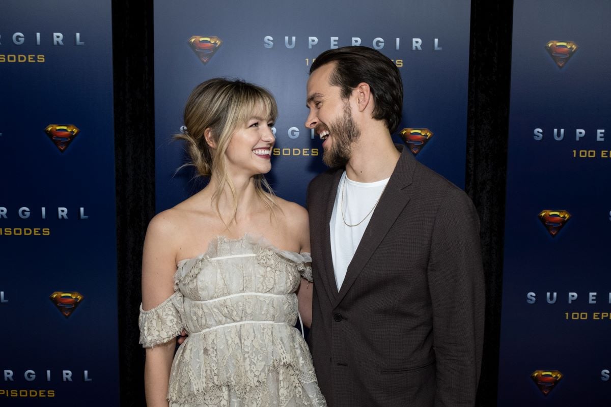 Melissa Benoist and Chris Wood pose for pictures at the'Supergirl' 100 episode celebration.